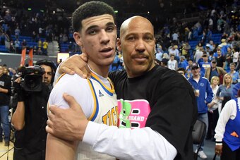 Mar 4, 2017; Los Angeles, CA, USA; Lavar Ball embraces his son UCLA Bruins guard Lonzo Ball (2) after the game against the Washington State Cougars at Pauley Pavilion. Mandatory Credit: Richard Mackson-USA TODAY Sports