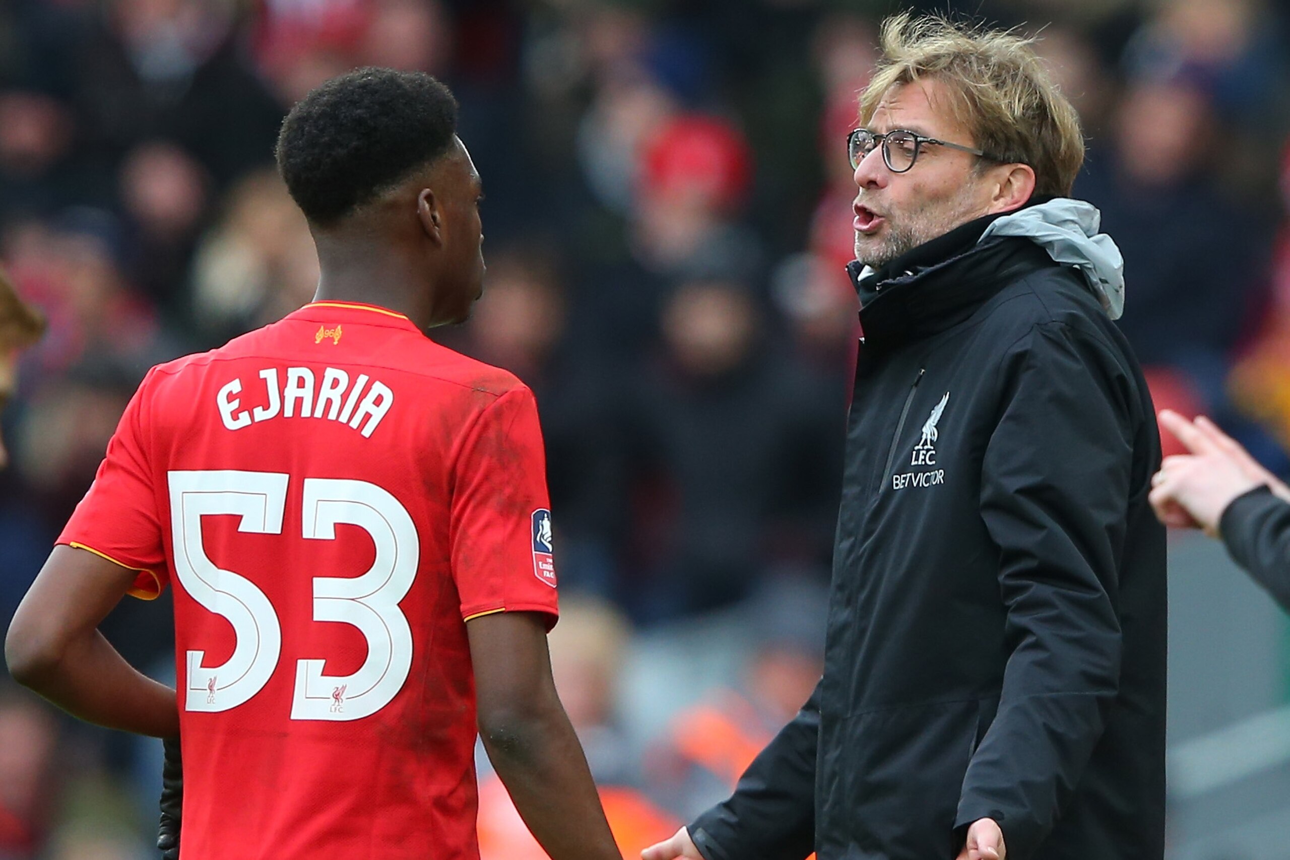 LIVERPOOL, ENGLAND - JANUARY 28: Oviemuno Ejaria of Liverpool speaks with Jurgen Klopp manager of Liverpool during the Emirates FA Cup Fourth Round match between Liverpool and Wolverhampton Wanderers at Anfield on January 28, 2017 in Liverpool, England.  