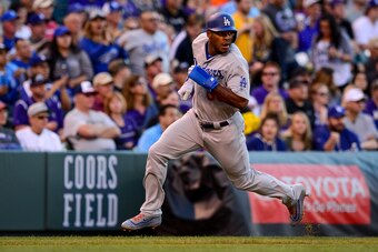 DENVER, CO - MAY 12: Yasiel Puig #66 of the Los Angeles Dodgers runs toward home plate to score in the second inning of a game against the Colorado Rockies at Coors Field on May 12, 2017 in Denver, Colorado.  (Photo by Dustin Bradford/Getty Images)