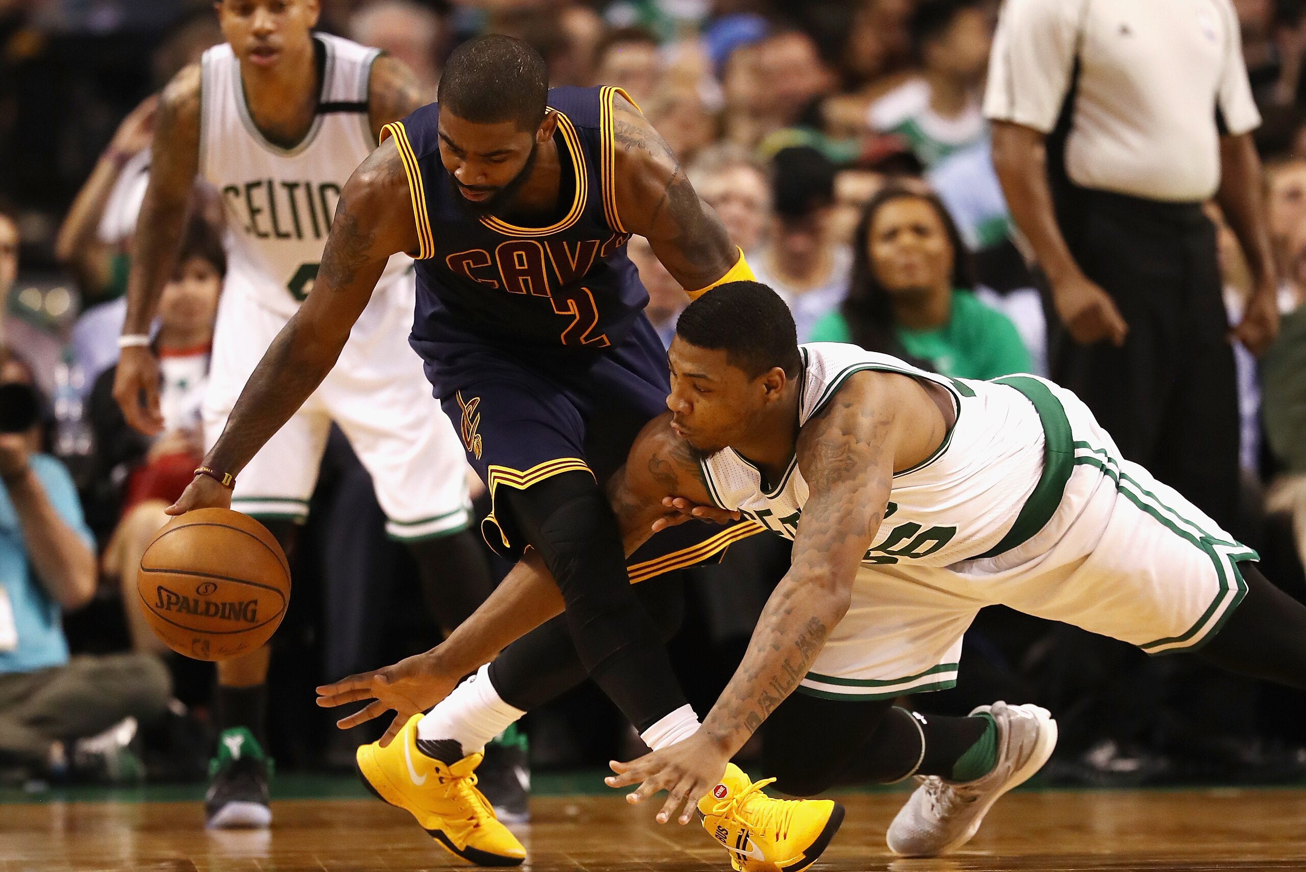 BOSTON, MA - MAY 17:  Kyrie Irving #2 of the Cleveland Cavaliers and Marcus Smart #36 of the Boston Celtics battle for the ball in the second half during Game One of the 2017 NBA Eastern Conference Finals at TD Garden on May 17, 2017 in Boston, Massachuse