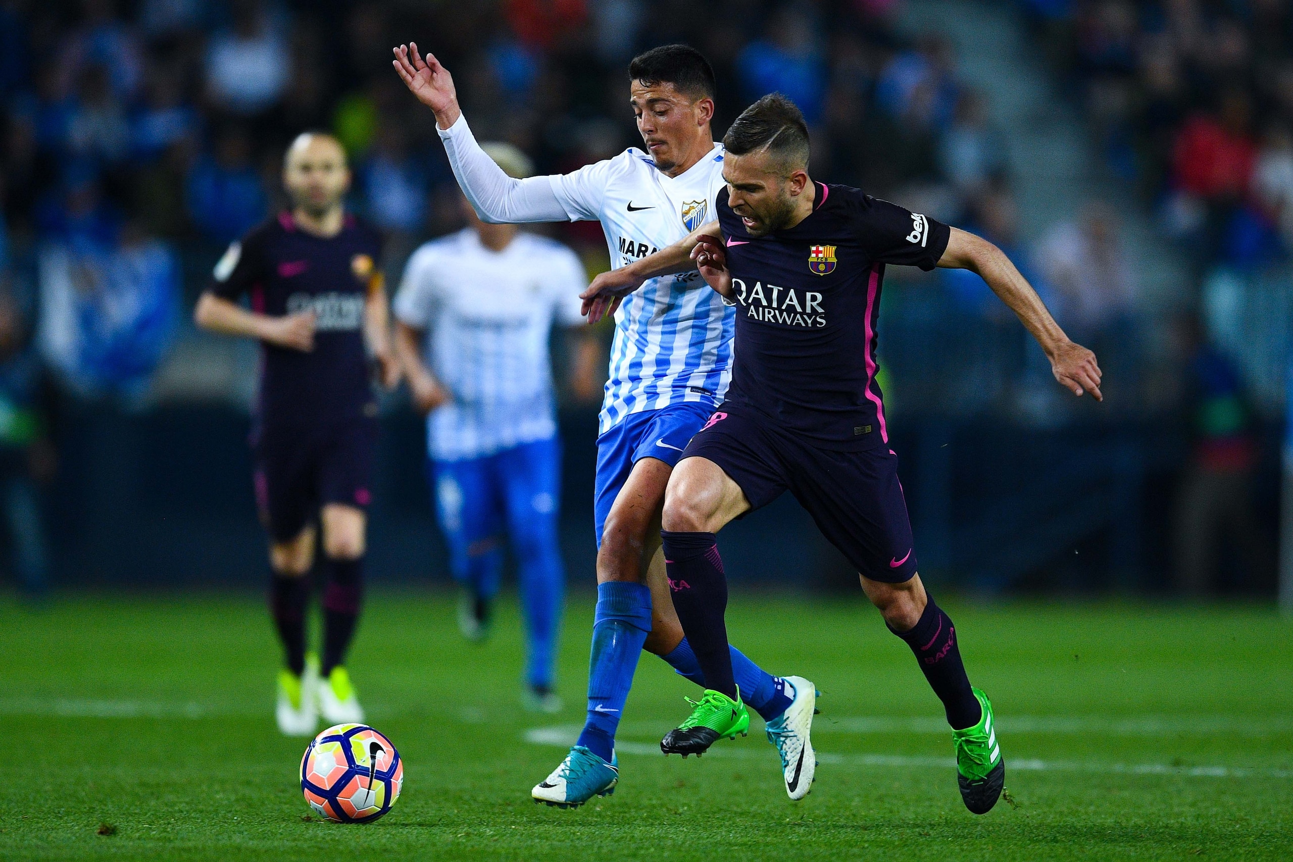MALAGA, SPAIN - APRIL 08:  Jordi Alba of FC Barcelona competes for the ball with Pablo Fornals of Malaga CF during the La Liga match between Malaga CF and FC Barcelona at La Rosaleda stadium on April 8, 2017 in Malaga, Spain.  (Photo by David Ramos/Getty 