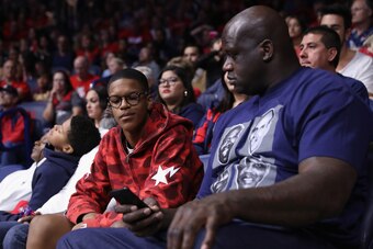 TUCSON, AZ - NOVEMBER 18:  NBA legend Shaquille O'neal (R) and son Shareef attend the college basketball game between the Arizona Wildcats and the Sacred Heart Pioneers at McKale Center on November 18, 2016 in Tucson, Arizona.  (Photo by Christian Peterse