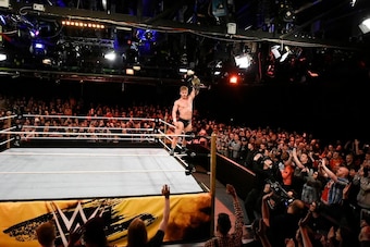 Tyler Bate shows off his U.K. Championship.