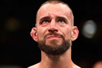 CLEVELAND, OH - SEPTEMBER 10:  Phil 'CM Punk' Brooks stands in the Octagon after being defeated by Mickey Gall by submission in their welterweight bout during the UFC 203 event at Quicken Loans Arena on September 10, 2016 in Cleveland, Ohio. (Photo by Jos