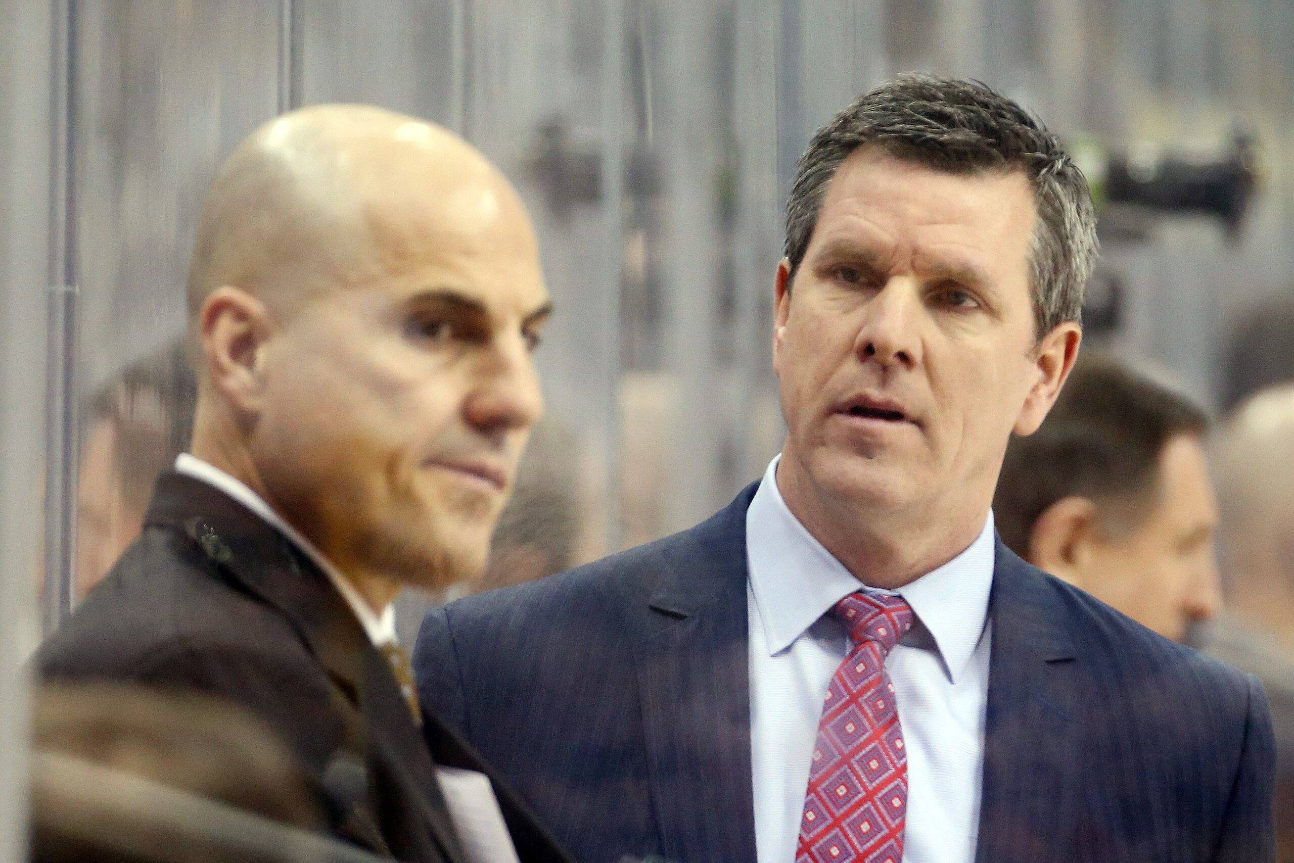 Mar 26, 2017; Pittsburgh, PA, USA;  Pittsburgh Penguins head coach Mike Sullivan (R) talks to assistant coach Rick Tocchet (L) on the bench against the Philadelphia Flyers during the second period at the PPG PAINTS Arena. Mandatory Credit: Charles LeClair