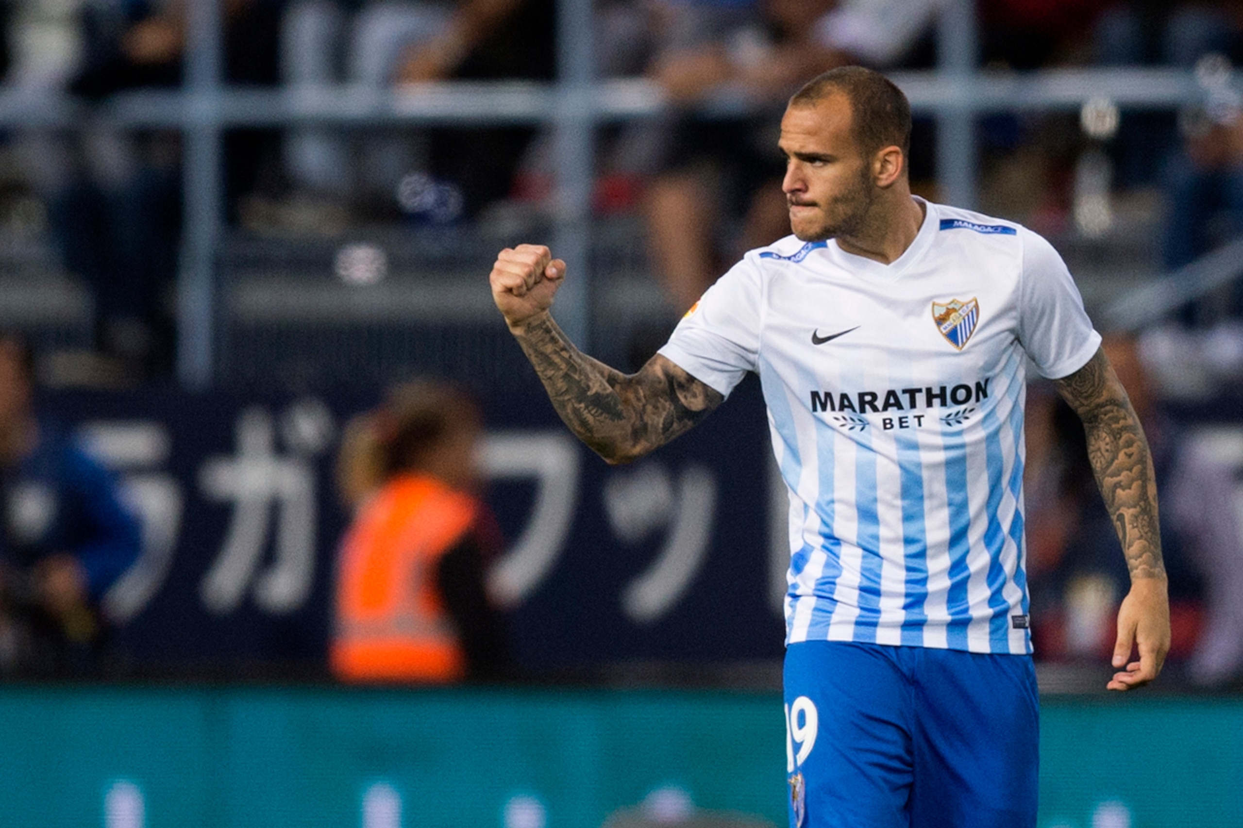 Malaga's forward Sandro Ramirez celebrates after scoring during the Spanish league football match Malaga CF vs Sevilla FC at La Rosaleda stadium in Malaga on May 1, 2017. / AFP PHOTO / JORGE GUERRERO        (Photo credit should read JORGE GUERRERO/AFP/Get