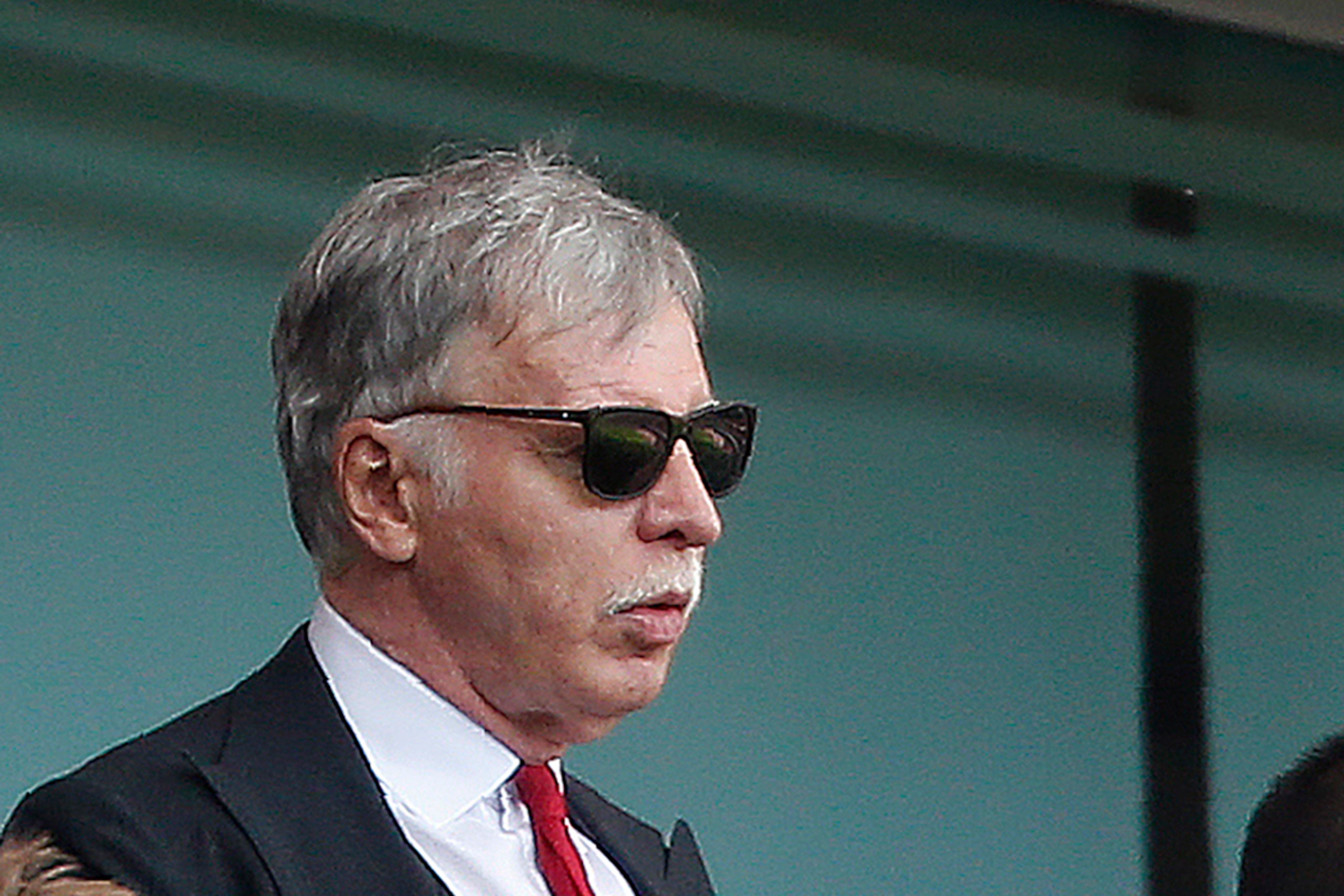 Arsenal's US Owner Stan Kroenke (L) watches ahead of the English Premier League football match between Arsenal and Aston Villa at the Emirates Stadium in London on May 15, 2016.  / AFP / Ian Kington / RESTRICTED TO EDITORIAL USE. No use with unauthorized 