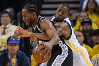 OAKLAND, CA - MAY 14:  Andre Iguodala #9 of the Golden State Warriors defends against Kawhi Leonard #2 of the San Antonio Spurs during Game One of the NBA Western Conference Finals at ORACLE Arena on May 14, 2017 in Oakland, California. NOTE TO USER: User