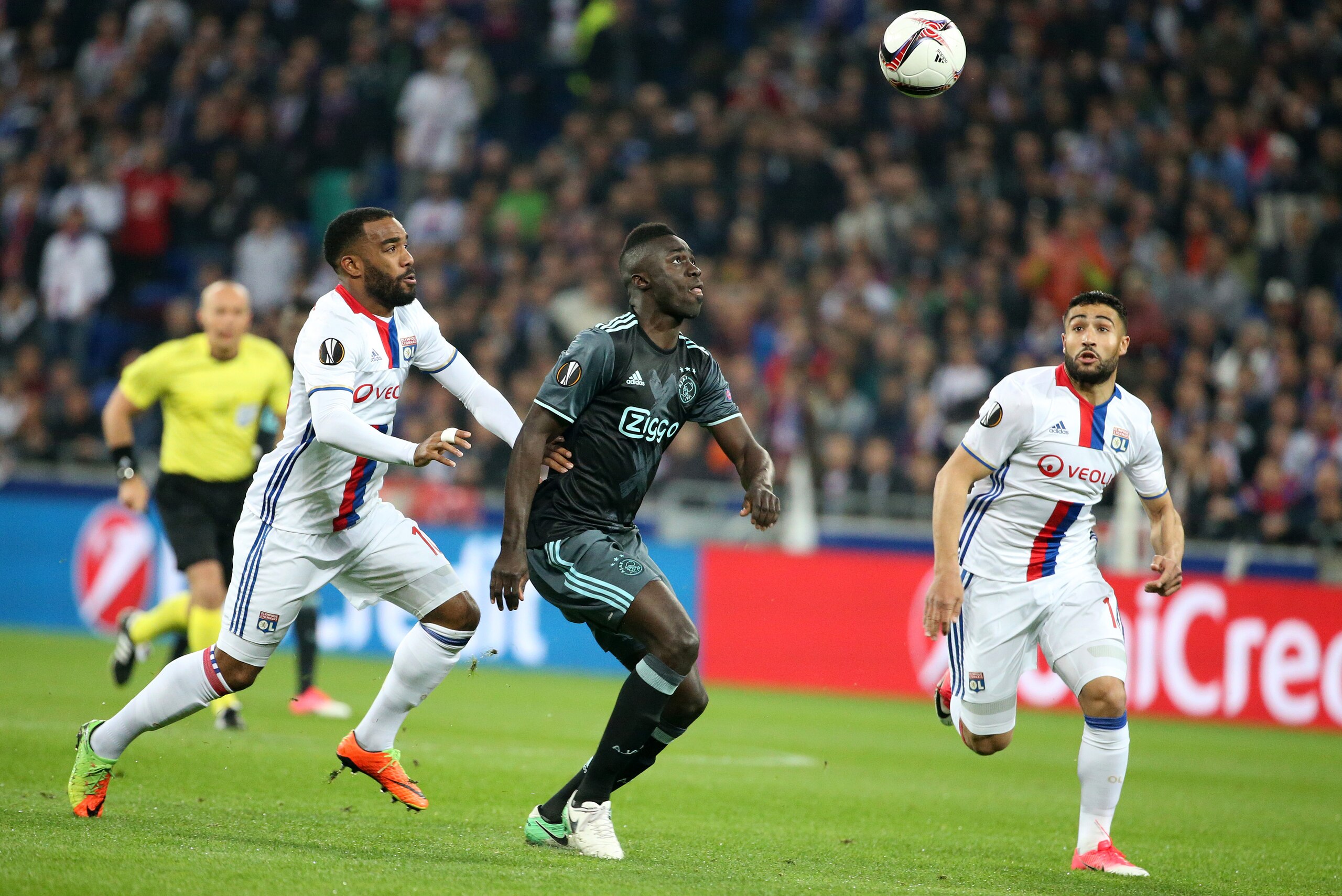 LYON, FRANCE - MAY 11: Davinson Sanchez of Ajax Amsterdam between Alexandre Lacazette and Nabil Fekir of Lyon during the UEFA Europa League, semi final second leg match between Olympique Lyonnais (OL) and Ajax Amsterdam at Parc OL on May 11, 2017 in Lyon,