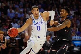 GREENVILLE, SC - MARCH 19:  Jayson Tatum #0 of the Duke Blue Devils dribbles against Chris Silva #30 of the South Carolina Gamecocks in the first half during the second round of the 2017 NCAA Men's Basketball Tournament at Bon Secours Wellness Arena on Ma