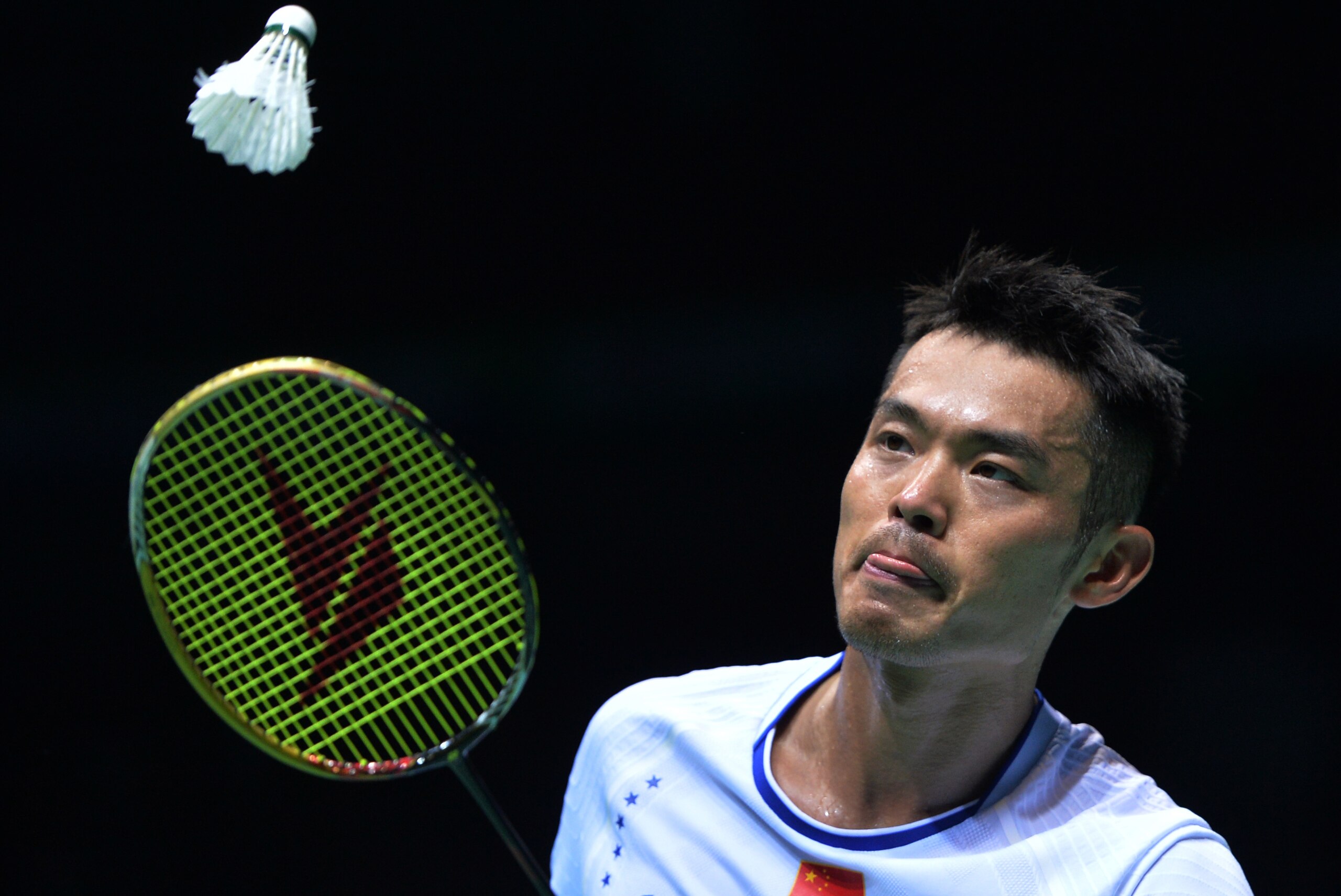 China's Lin Dan hits a return during the men's singles final against compatriot Chen Long at the 2017 Badminton Asia Championships in Wuhan, in central China's Hubei province on April 30, 2017. / AFP PHOTO / STR / China OUT        (Photo credit should rea