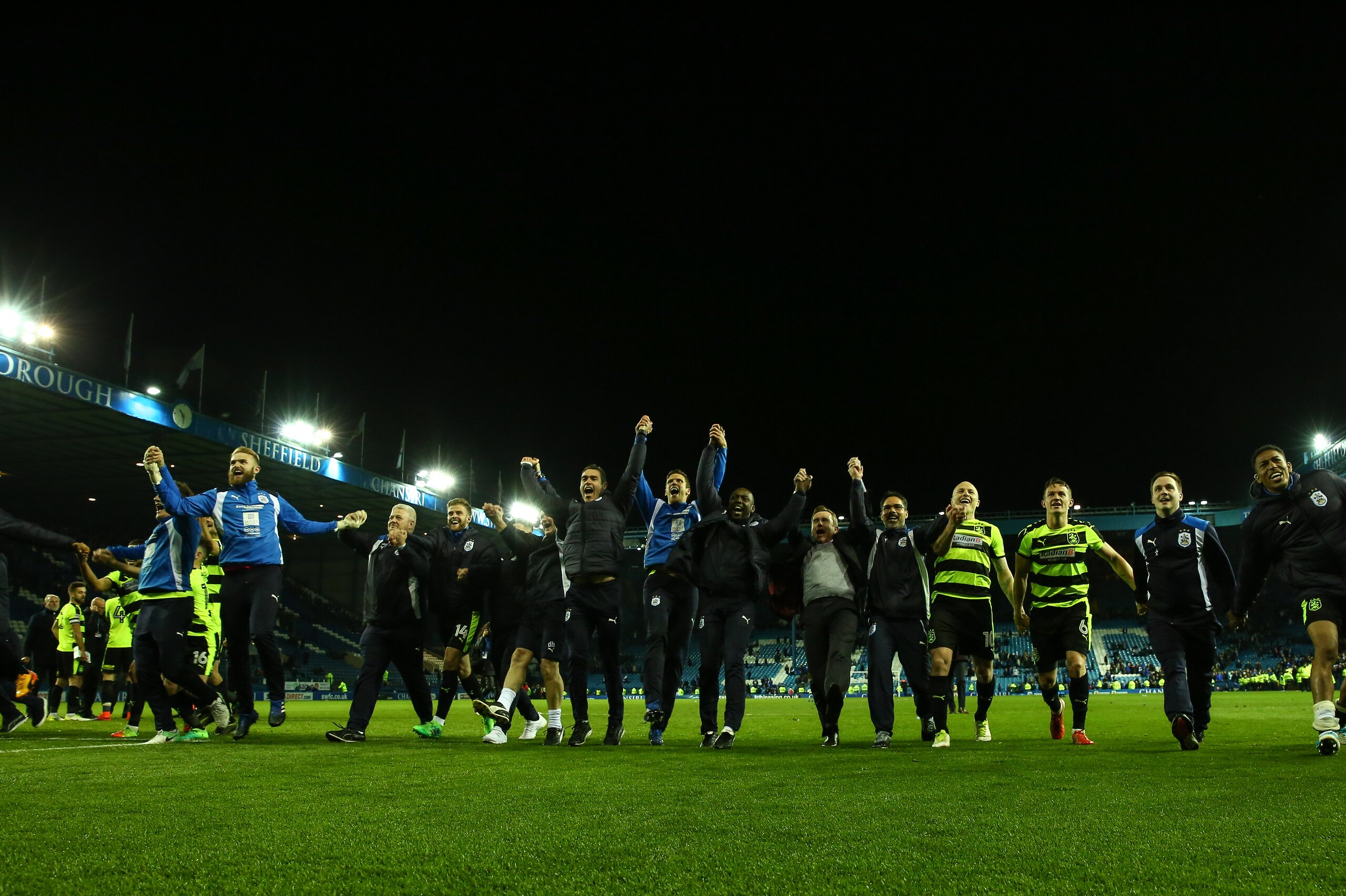 SHEFFIELD, ENGLAND - MAY 17: Huddersfield Town players celebrate at full time during the Sky Bet Championship match between Sheffield Wednesday and Huddersfield Town at Hillsborough Stadium on May 17, 2017 in Sheffield, England. (Photo by Robbie Jay Barra