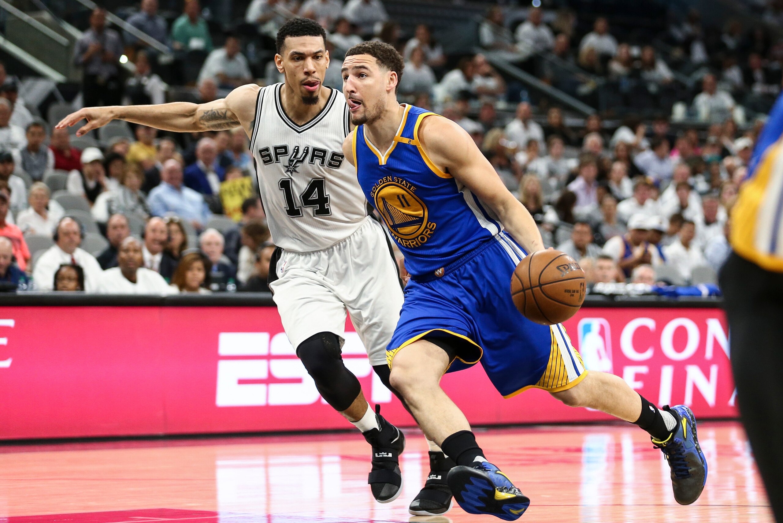 May 20, 2017; San Antonio, TX, USA; Golden State Warriors guard Klay Thompson (11) dribbles the ball as San Antonio Spurs guard Danny Green (14) defends during the third quarter in game three of the Western conference finals of the NBA Playoffs at AT&T Ce May 20, 2017; San Antonio, TX, USA; Golden State Warriors guard Klay Thompson (11) dribbles the ball as San Antonio Spurs guard Danny Green (14) defends during the third quarter in game three of the Western conference finals of the NBA Playoffs at AT&T Ce