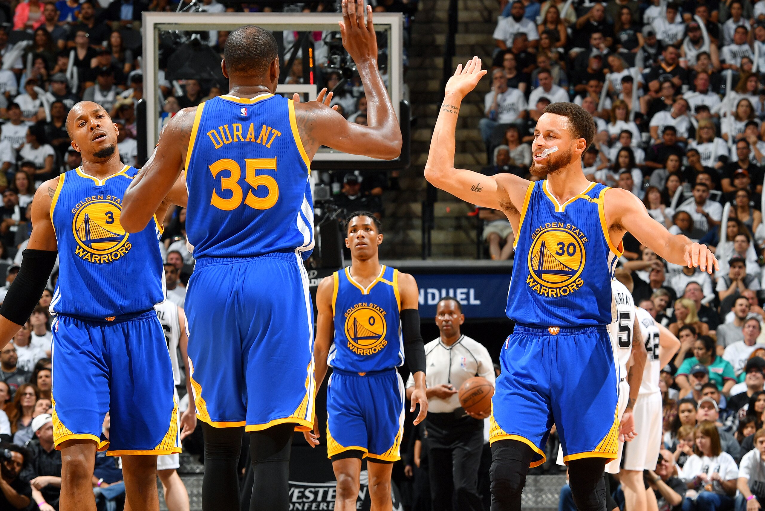 SAN ANTONIO, TX - MAY 20: Stephen Curry #30 and Kevin Durant #35 of the Golden State Warriors high five each other during the game against the San Antonio Spurs during Game Three of the Western Conference Finals of the 2017 NBA Playoffs on May 20, 2017 at