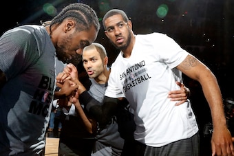 SAN ANTONIO,TX - FEBRUARY 3: Kawhi Leonard #2 of the San Antonio Spurs,Tony Parker #9 of the San Antonio Spurs and LaMarcus Aldridge #12 of the San Antonio Spurs huddle before their game against the New Orleans Pelicans at AT&T Center on February 3, 2016 