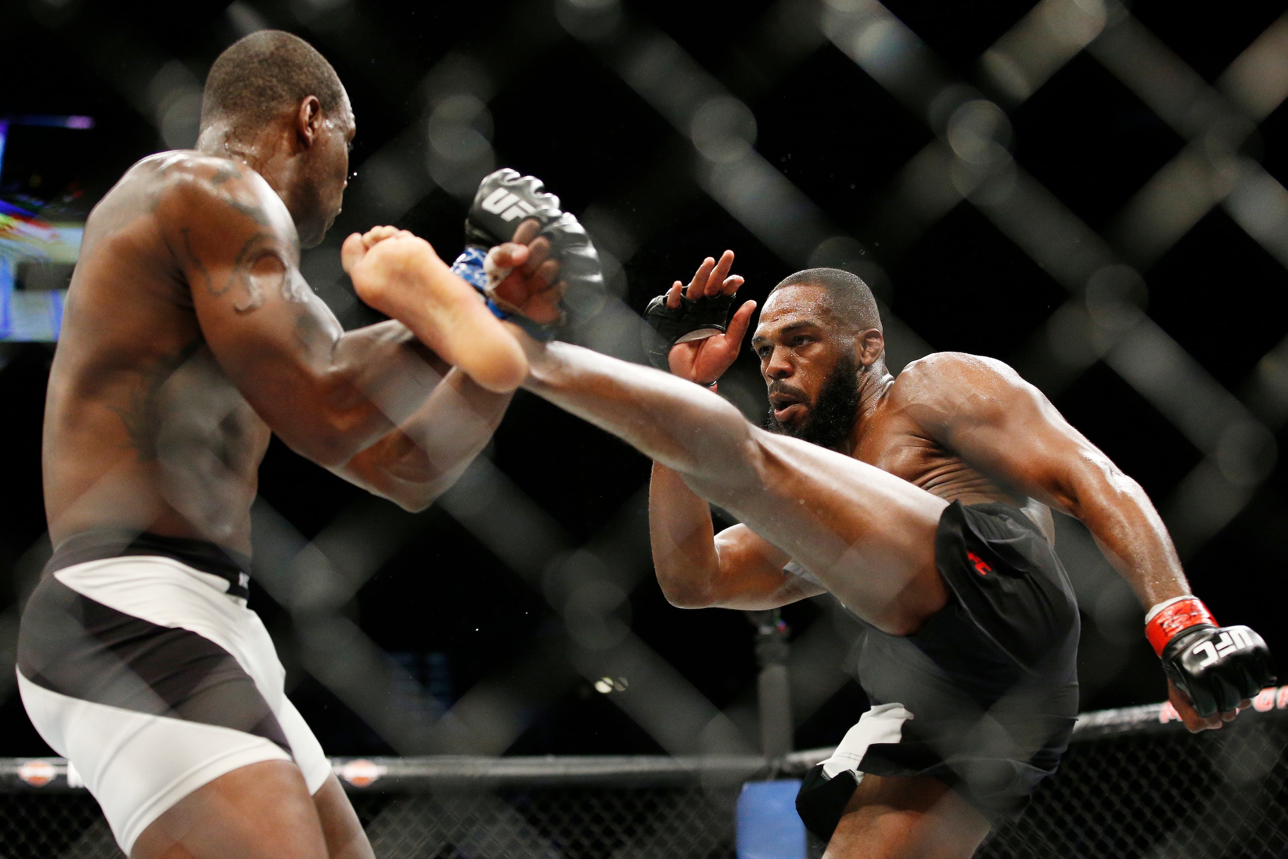 Jones throws a kick at OSP at UFC 197.