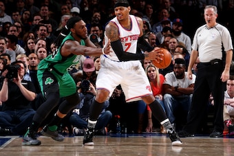 NEW YORK, NY - FEBRUARY 2: Carmelo Anthony #7 of the New York Knicks defends the ball against Jae Crowder #99 of the Boston Celtics during the game on February 2, 2016 at Madison Square Garden in New York, New York. NOTE TO USER: User expressly acknowledg