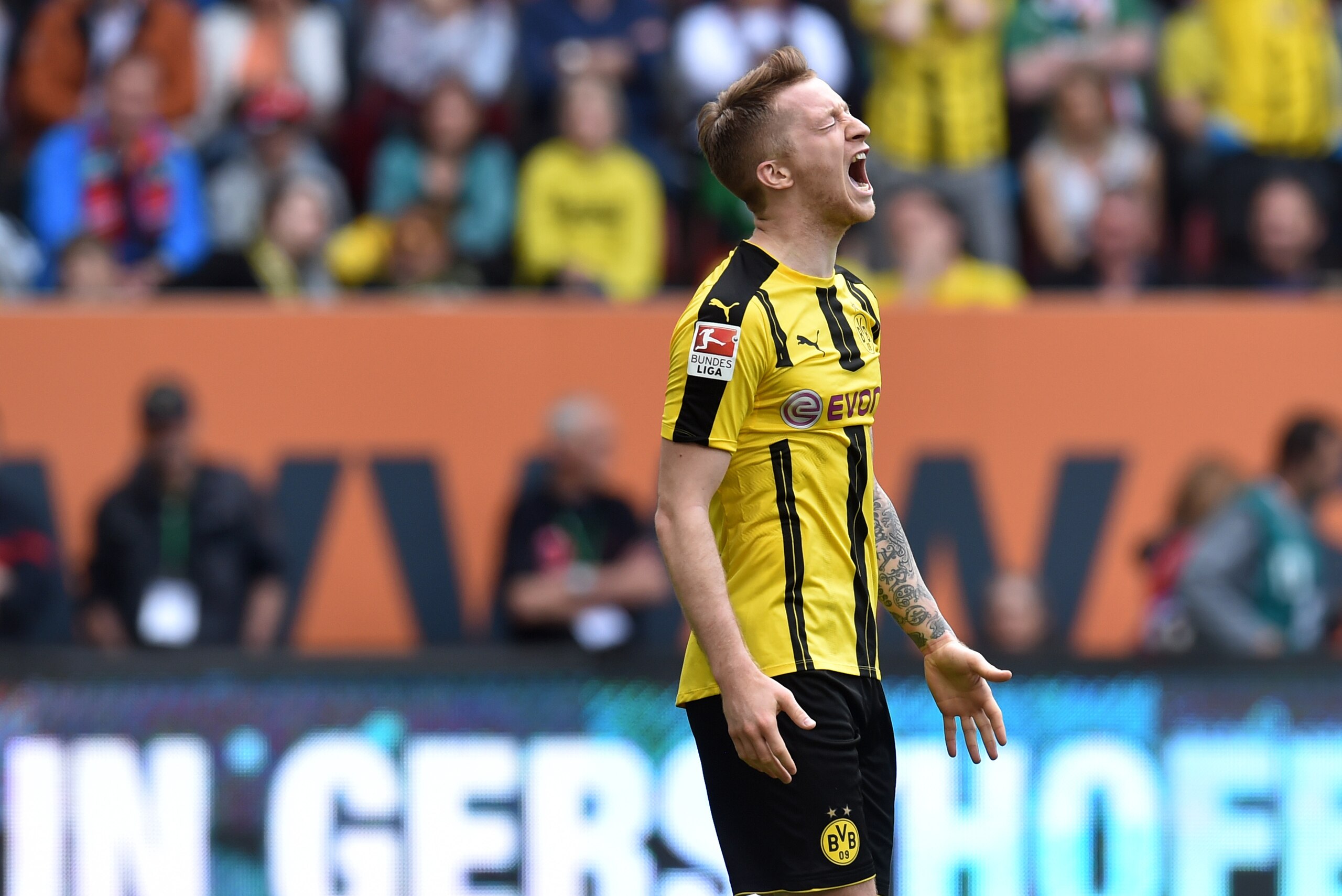 Dortmund's midfielder Marco Reus reacts after a chance during the German first division Bundesliga football match between FC Augsburg and Borussia Dortmund on May 13, 2017 in Augsburg, southern Germany.  / AFP PHOTO / Christof STACHE / RESTRICTIONS: DURIN