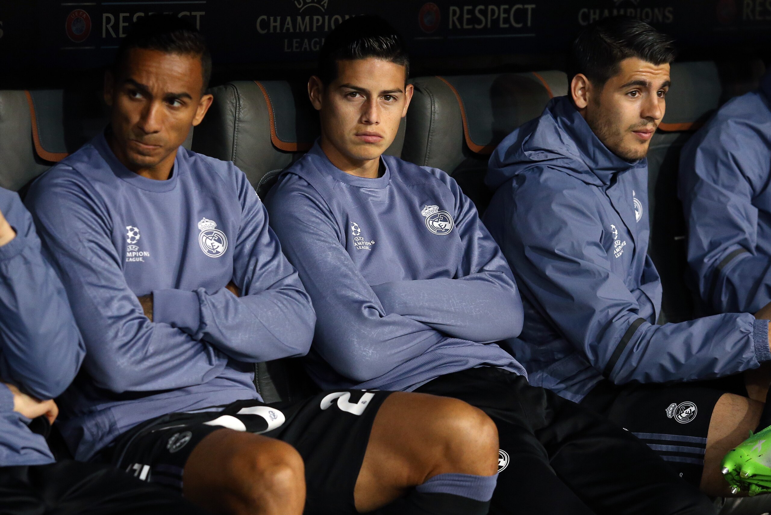MUNICH, GERMANY - APRIL 12: Danilo Luiz da Silva, James Rodriguez, Alvaro Morata of Real Madrid seat on the bench during the UEFA Champions League Quarter Final first leg match between FC Bayern Muenchen (Bayern Munich) and Real Madrid CF at Allianz Arena