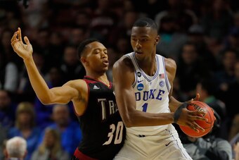 GREENVILLE, SC - MARCH 17:  Alex Hicks #30 of the Troy Trojans plays defense against Harry Giles #1 of the Duke Blue Devils in the first half during the first round of the 2017 NCAA Men's Basketball Tournament at Bon Secours Wellness Arena on March 17, 20