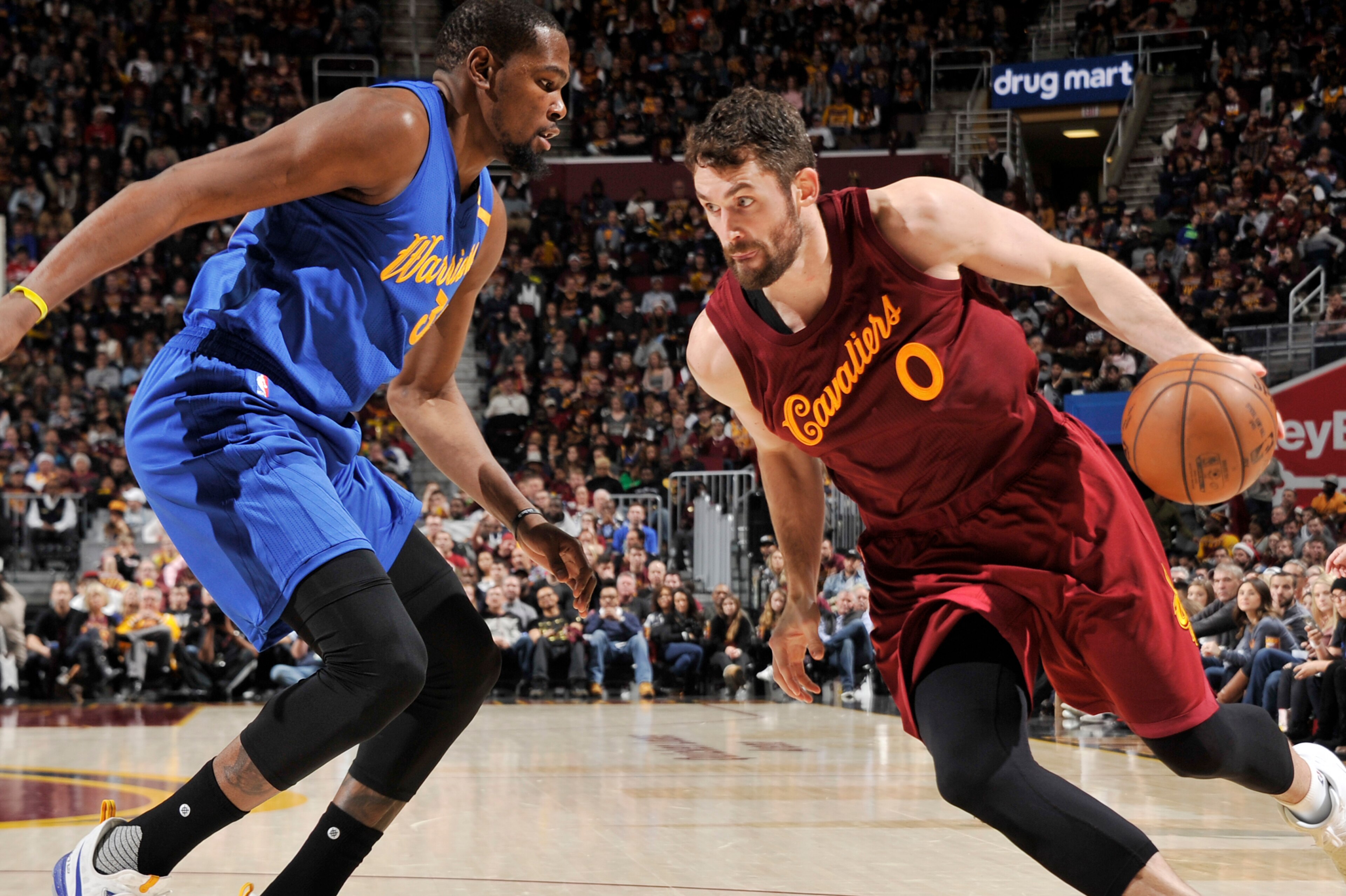 CLEVELAND, OH - DECEMBER 25:  Kevin Love #0 of the Cleveland Cavaliers drives to the basket against Kevin Durant #35 of the Golden State Warriors during the game on December 25, 2016 at Quicken Loans Arena in Cleveland, Ohio. NOTE TO USER: User expressly 