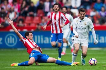 GIJON, SPAIN - APRIL 15: Mateo Kovacic of Real Madrid duels for the ball with Mikel Vesga of Real Sporting de Gijon during the La Liga match between Real Sporting de Gijon and Real Madrid at Estadio El Molinon on April 15, 2017 in Gijon, Spain.  (Photo by