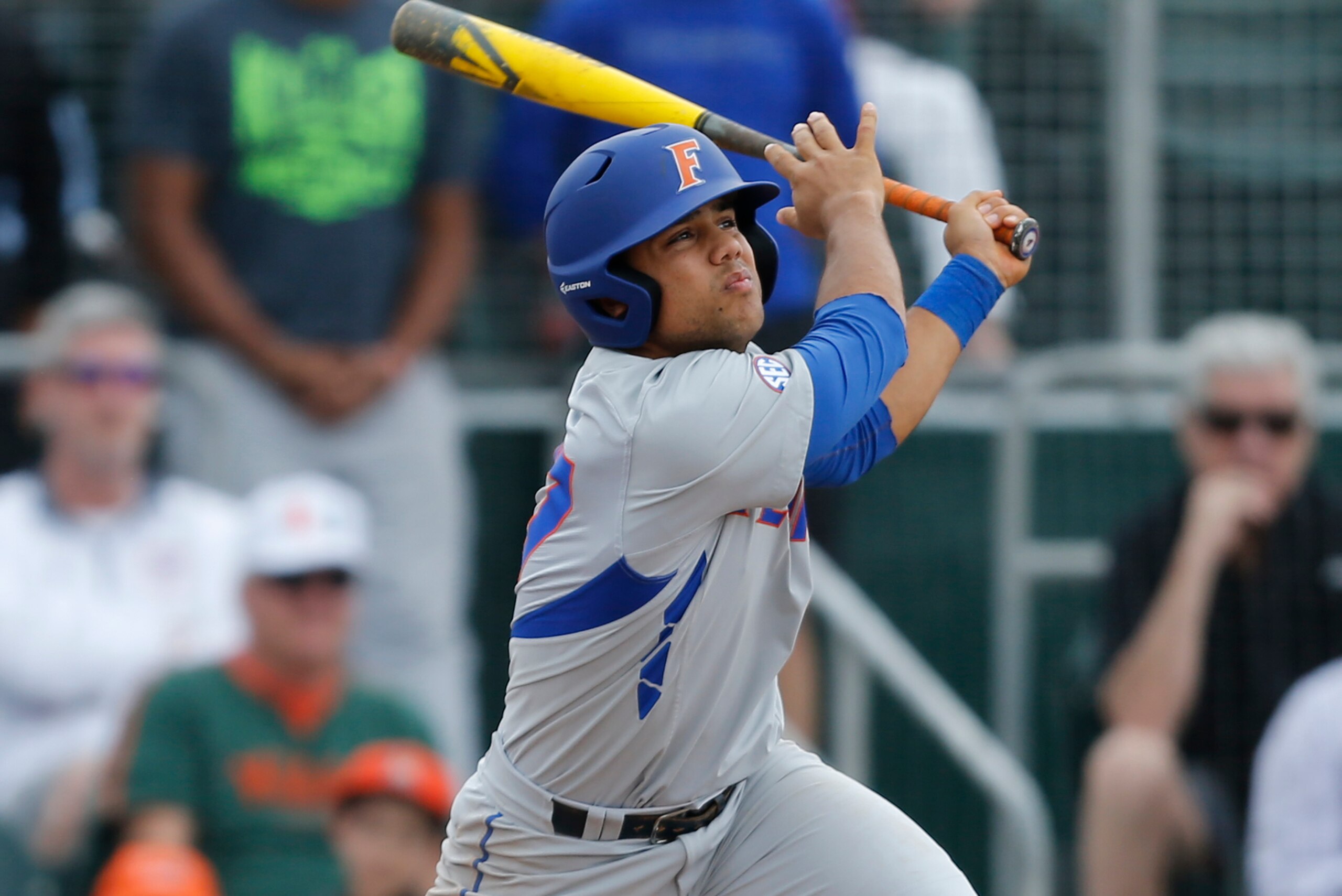 CORAL GABLES, FL - FEBRUARY 28: Nelson Maldonado #27 of the Florida Gators hits the ball against the Miami Hurricanes on February 28, 2016 at Alex Rodriguez Park at Mark Light Field in Coral Gables, Florida. Florida defeated Miami 7-3. (Photo by Joel Auer