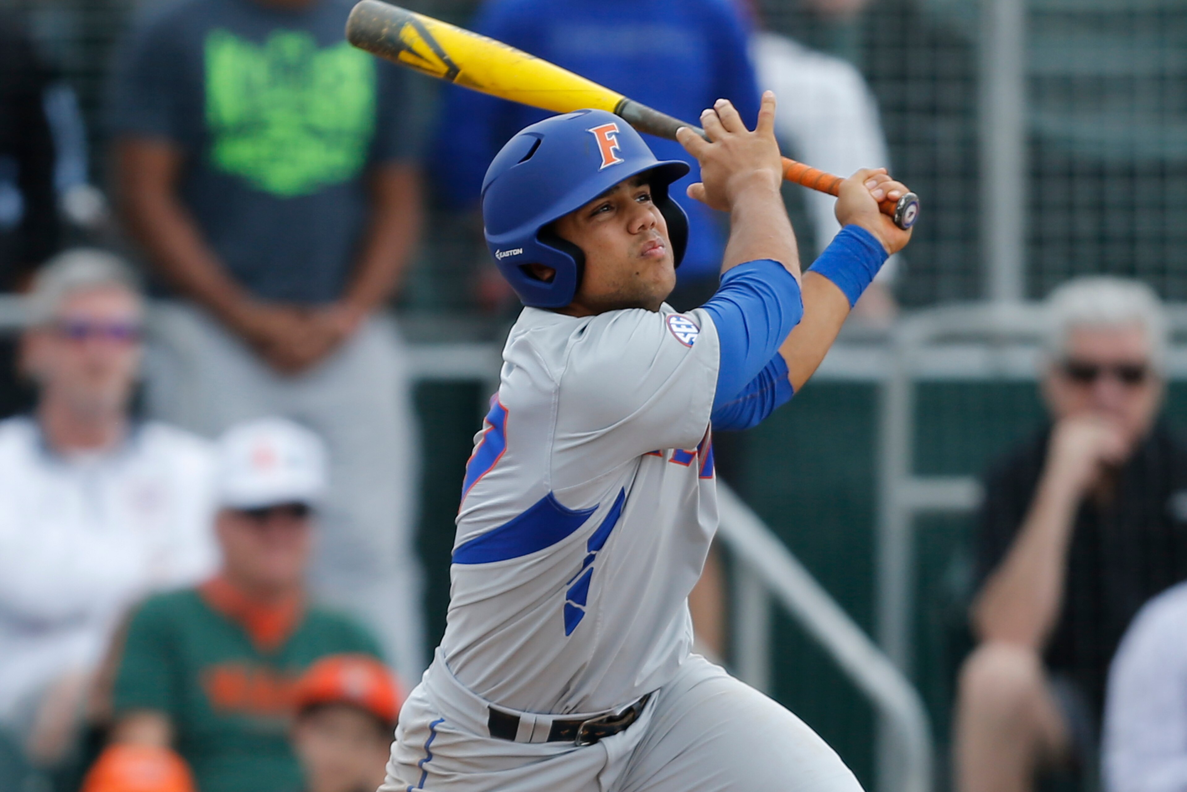 CORAL GABLES, FL - FEBRUARY 28: Nelson Maldonado #27 of the Florida Gators hits the ball against the Miami Hurricanes on February 28, 2016 at Alex Rodriguez Park at Mark Light Field in Coral Gables, Florida. Florida defeated Miami 7-3. (Photo by Joel Auer