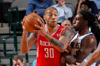 DALLAS, TX - OCTOBER 15: Royce White #30 of the Houston Rockets posts up against Jae Crowder #9 of the Dallas Mavericks on October 15, 2012 at the American Airlines Center in Dallas, Texas. NOTE TO USER: User expressly acknowledges and agrees that, by dow