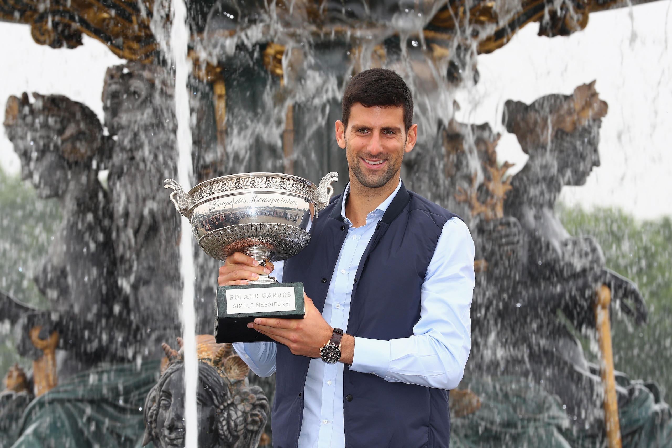 PARIS, FRANCE - JUNE 06:  Novak Djokovic of Serbia poses with the winners trophy at Place de La Concorde on June 6, 2016 in Paris, France.  (Photo by Julian Finney/Getty Images)