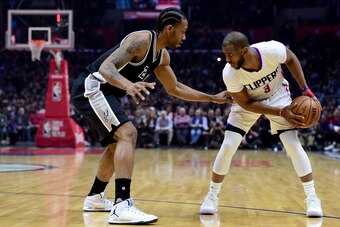 LOS ANGELES, CA - FEBRUARY 24:  Chris Paul #3 of the LA Clippers is guarded by Kawhi Leonard #2 of the San Antonio Spurs during the first half at Staples Center on February 24, 2017 in Los Angeles, California.  NOTE TO USER: User expressly acknowledges an