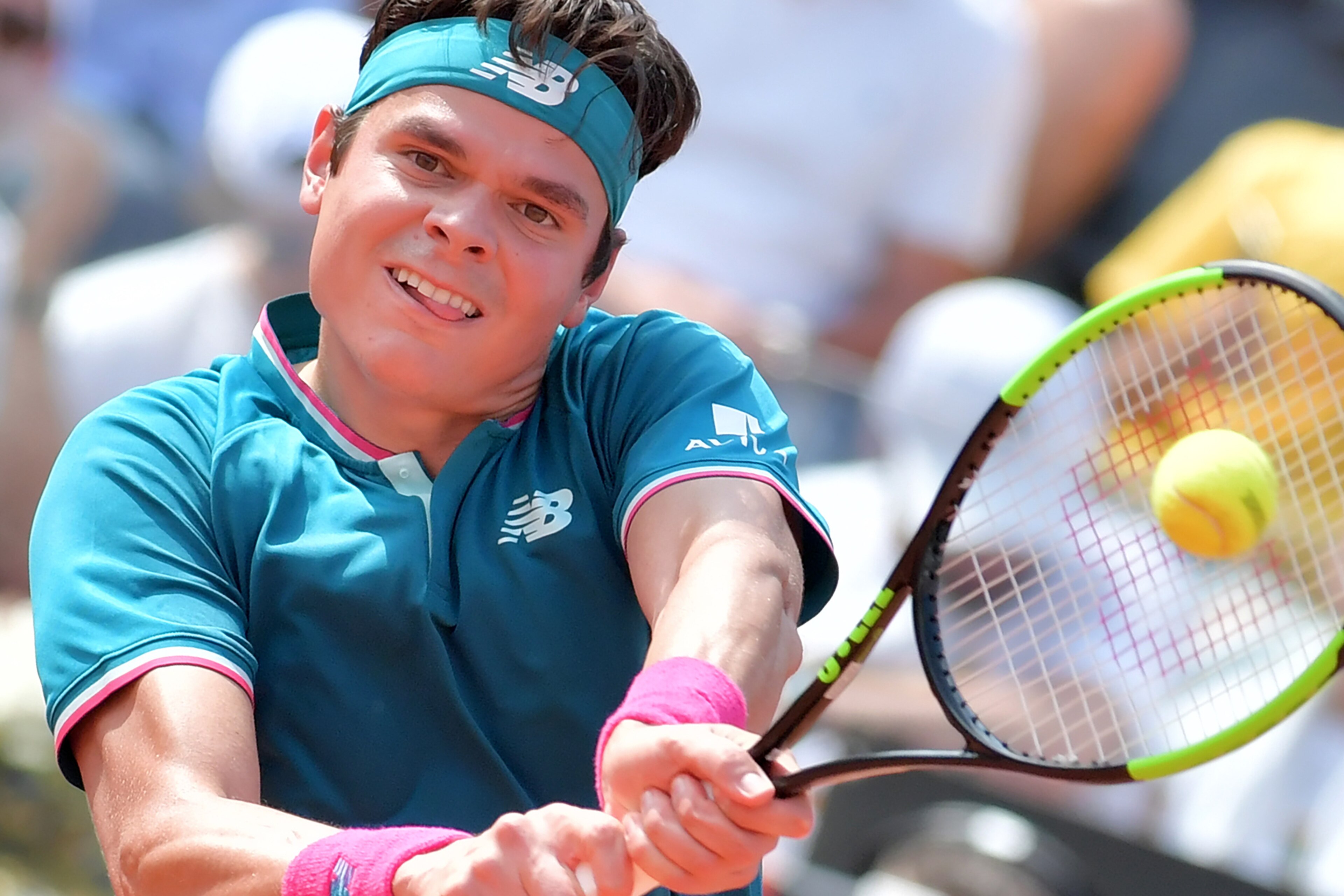 Milos Raonic of Canada returns the ball to Alexander Zverev of Germany during the ATP Tennis Open tournament on May 19, 2017 at the Foro Italico in Rome.  / AFP PHOTO / TIZIANA FABI        (Photo credit should read TIZIANA FABI/AFP/Getty Images)