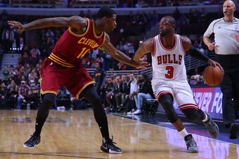 Oct 14, 2016; Chicago, IL, USA; Chicago Bulls guard Dwyane Wade (3) drives past Cleveland Cavaliers guard DeAndre Liggins (14) during the first quarter at the United Center. Mandatory Credit: Dennis Wierzbicki-USA TODAY Sports