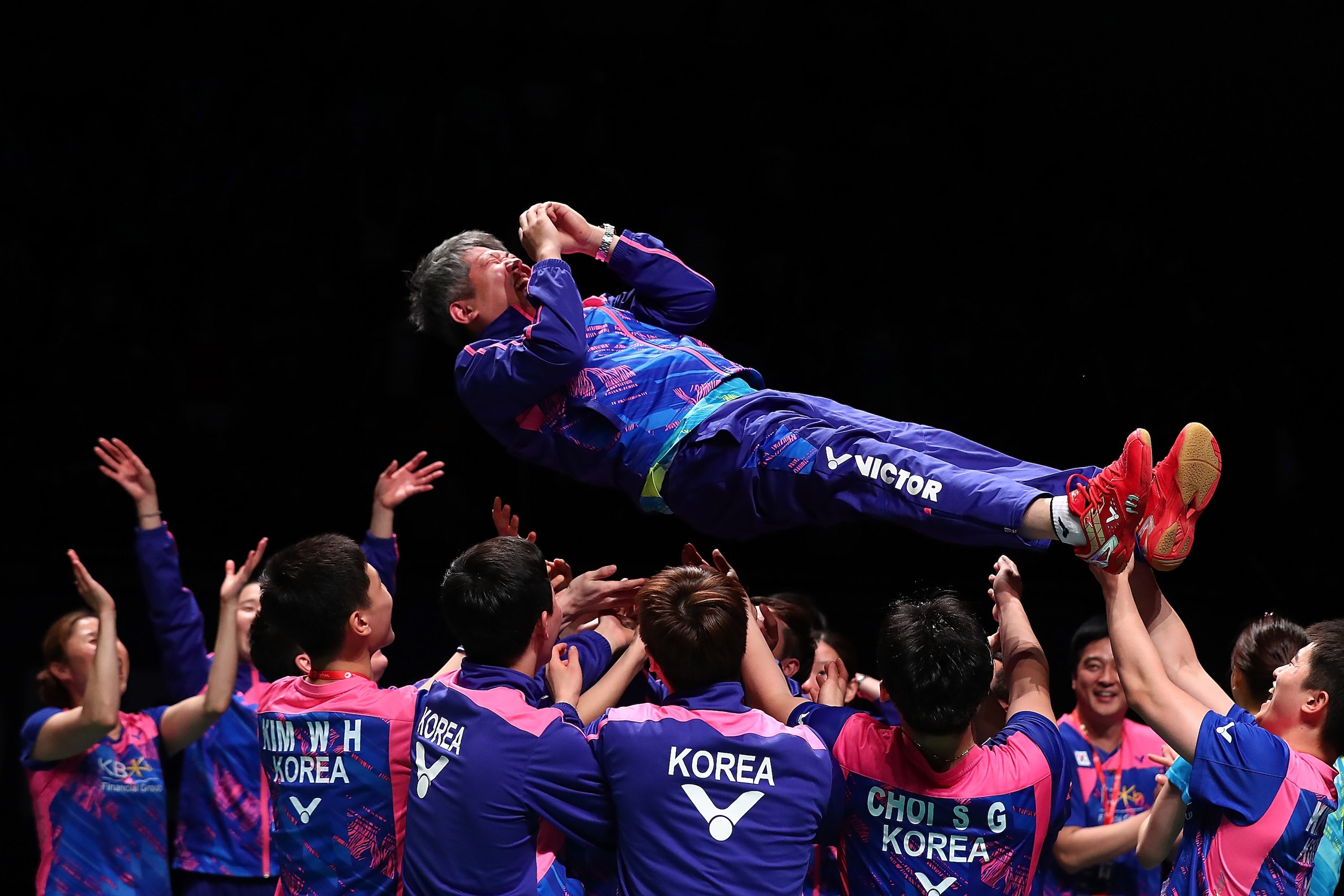 GOLD COAST, AUSTRALIA - MAY 28:  Korea coach Kang Kyung Jin is thrown in the air after winning the Final match against China during the Sudirman Cup at the Carrara Sports & Leisure Centre on May 28, 2017 in Gold Coast, Australia.  (Photo by Chris Hyde/Get