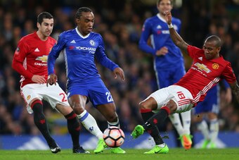 LONDON, ENGLAND - MARCH 13: Willian of Chelsea is tackled by Ashley Young of Manchester United during The Emirates FA Cup Quarter-Final match between Chelsea and Manchester United at Stamford Bridge on March 13, 2017 in London, England. (Photo by Catherin