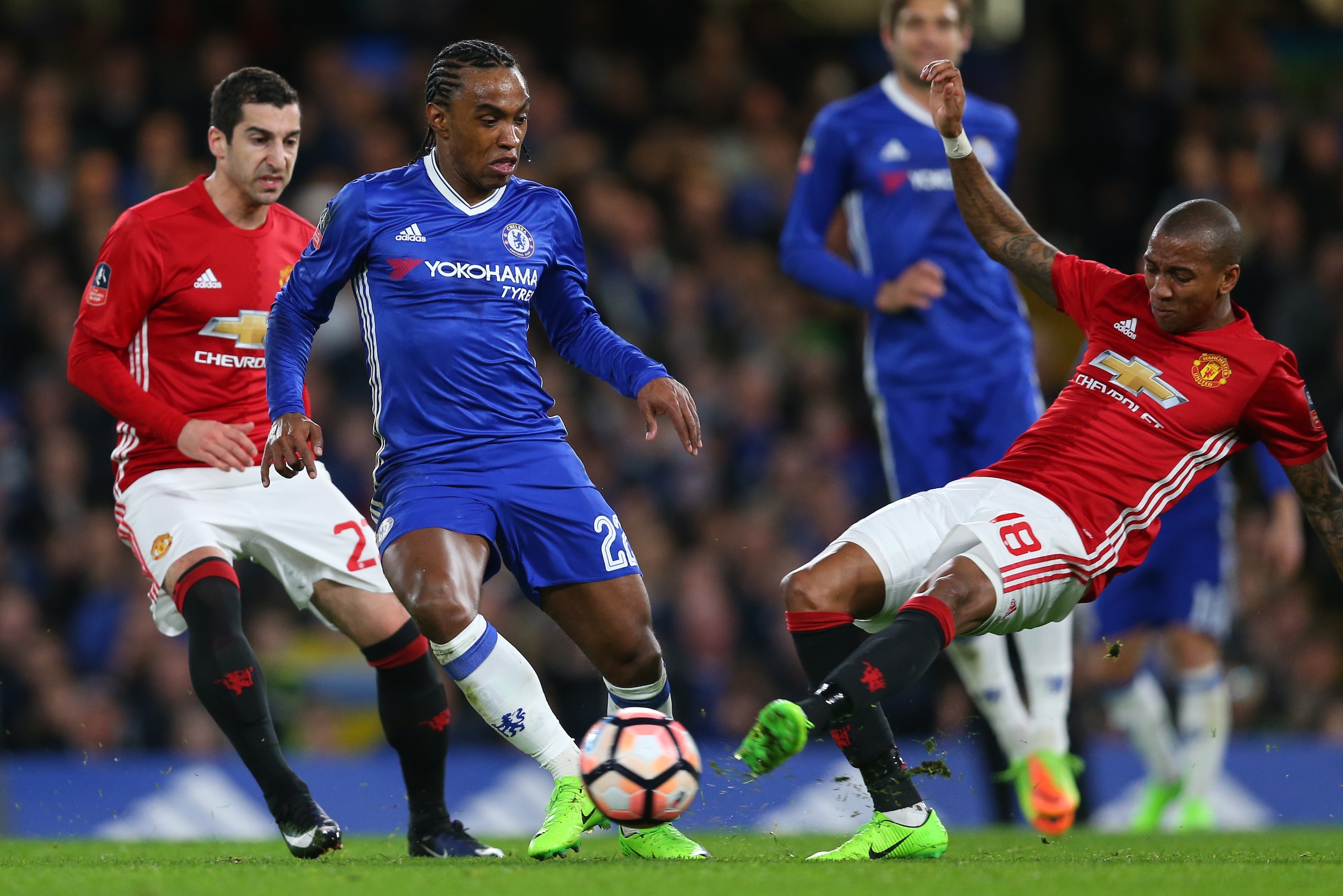 LONDON, ENGLAND - MARCH 13: Willian of Chelsea is tackled by Ashley Young of Manchester United during The Emirates FA Cup Quarter-Final match between Chelsea and Manchester United at Stamford Bridge on March 13, 2017 in London, England. (Photo by Catherin