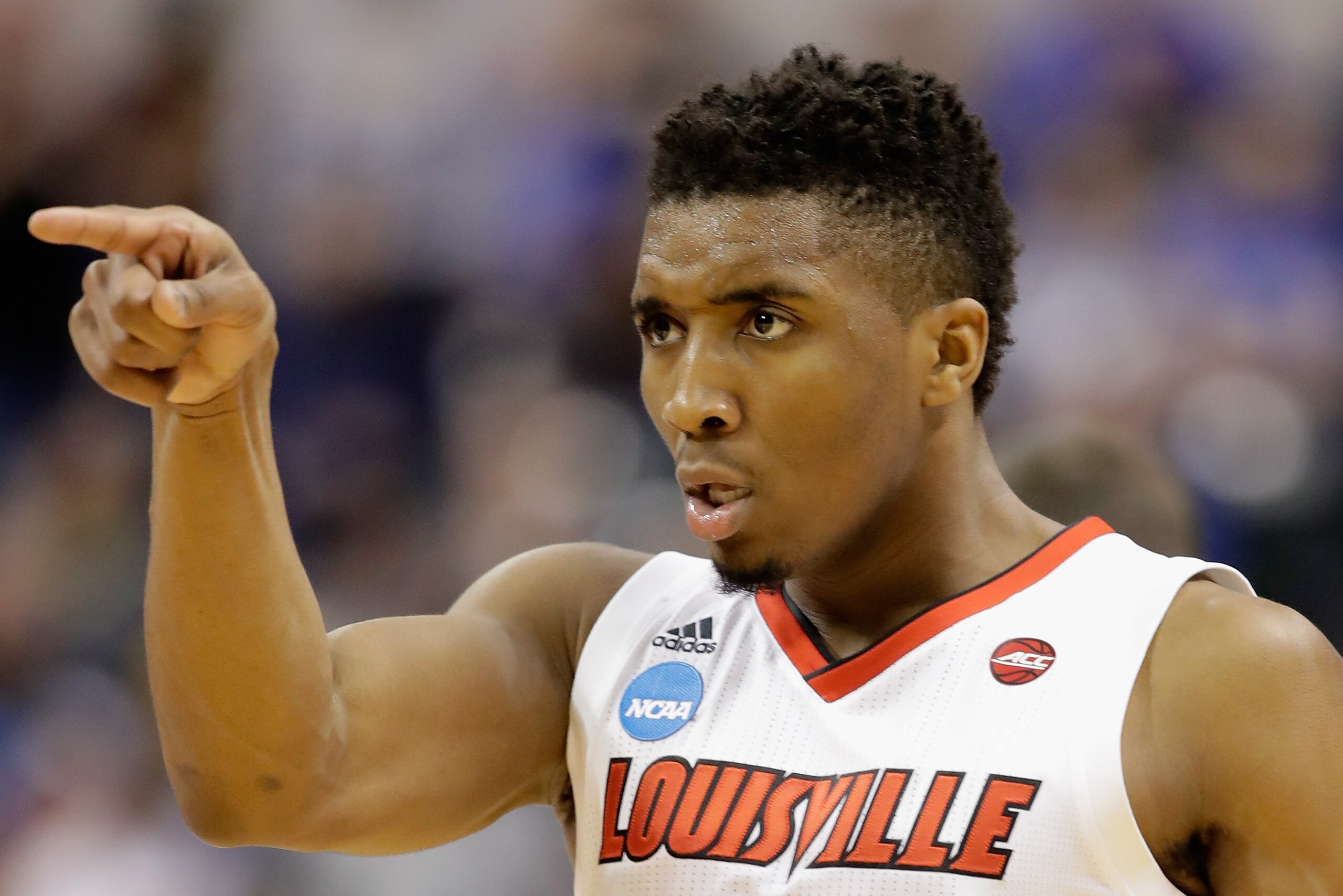 INDIANAPOLIS, IN - MARCH 19:  Donovan Mitchell #45 of the Louisville Cardinals reacts against the Michigan Wolverines in the first half during the second round of the 2017 NCAA Men's Basketball Tournament at the Bankers Life Fieldhouse on March 19, 2017 i