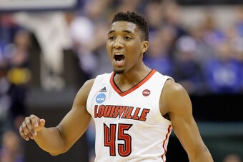 INDIANAPOLIS, IN - MARCH 19:  Donovan Mitchell #45 of the Louisville Cardinals reacts against the Michigan Wolverines in the first half during the second round of the 2017 NCAA Men's Basketball Tournament at the Bankers Life Fieldhouse on March 19, 2017 i
