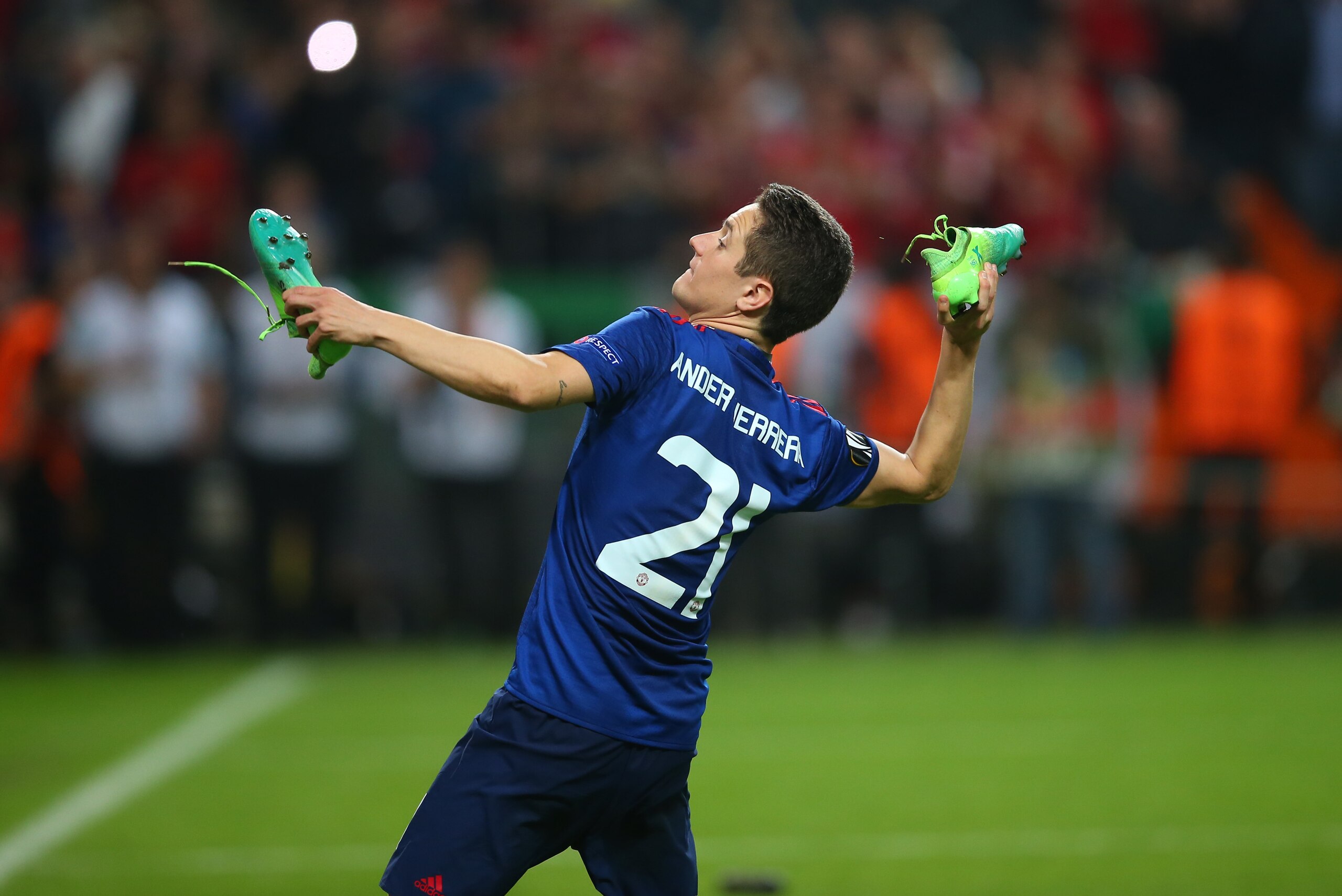 STOCKHOLM, SWEDEN - MAY 24:  Ander Herrera of Manchester United throws his boots to the crowd during the UEFA Europa League Final match between Ajax and Manchester United at Friends Arena on May 24, 2017 in Stockholm, Sweden. (Photo by Catherine Ivill - A