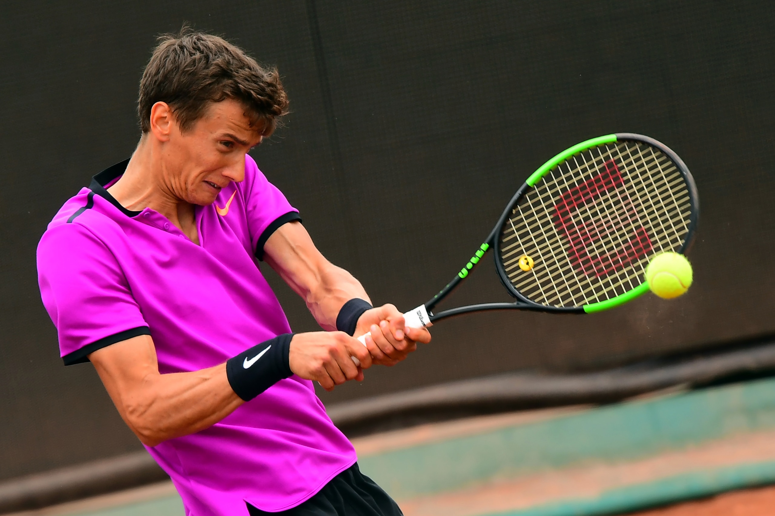 Russian Andrey Kuznetsov returns the ball to Italy's Fabio Fognini during their 2nd round tennis match at the Hungarian Open in Budapest, on April 27, 2017.        / AFP PHOTO / ATTILA KISBENEDEK        (Photo credit should read ATTILA KISBENEDEK/AFP/Gett