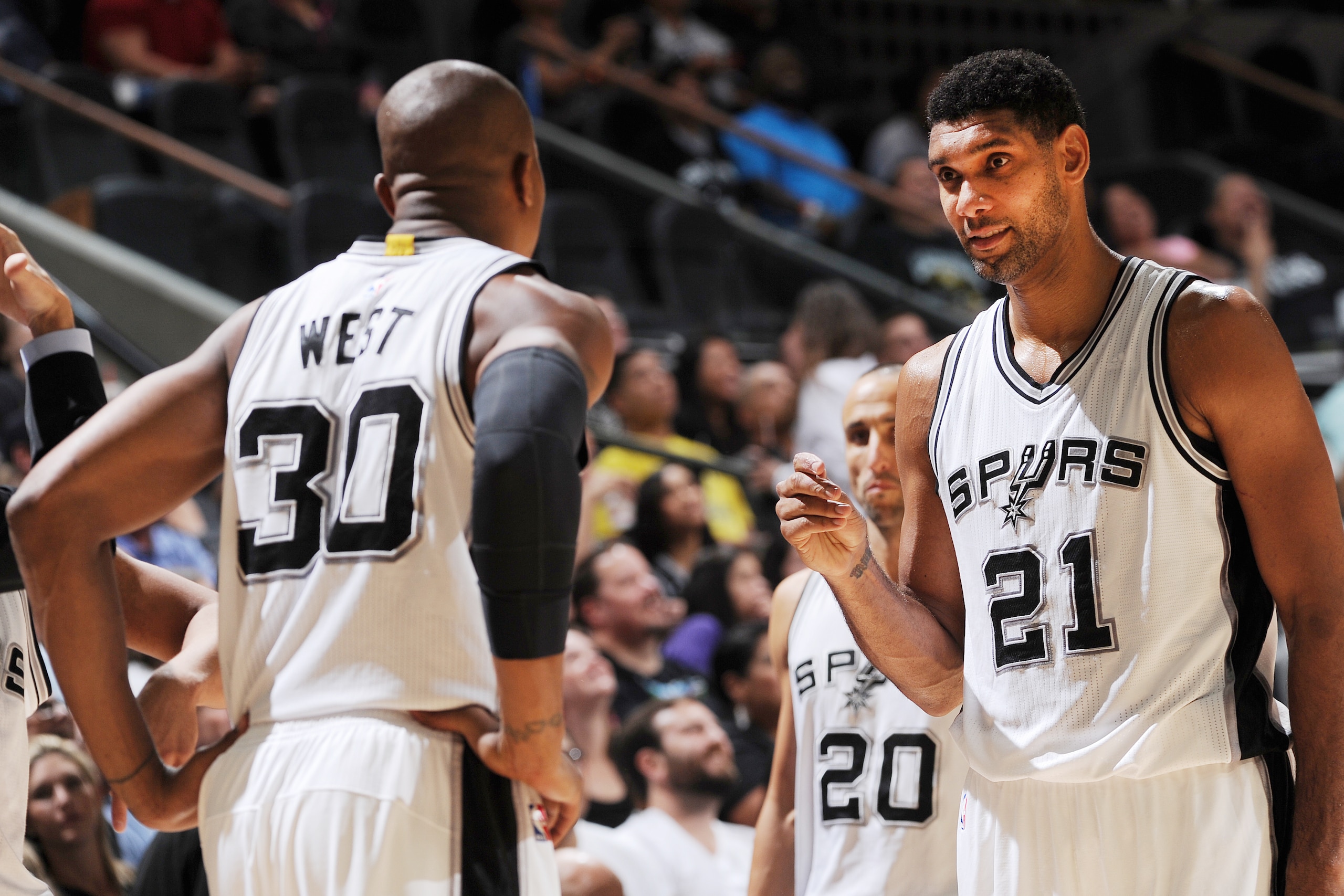 SAN ANTONIO, TX - OCTOBER 20:  David West #30 of the San Antonio Spurs talks with Tim Duncan #21 of the San Antonio Spurs during a preseason game against the Phoenix Suns on October 20, 2015 at the AT&T Center in San Antonio, Texas. NOTE TO USER: User exp