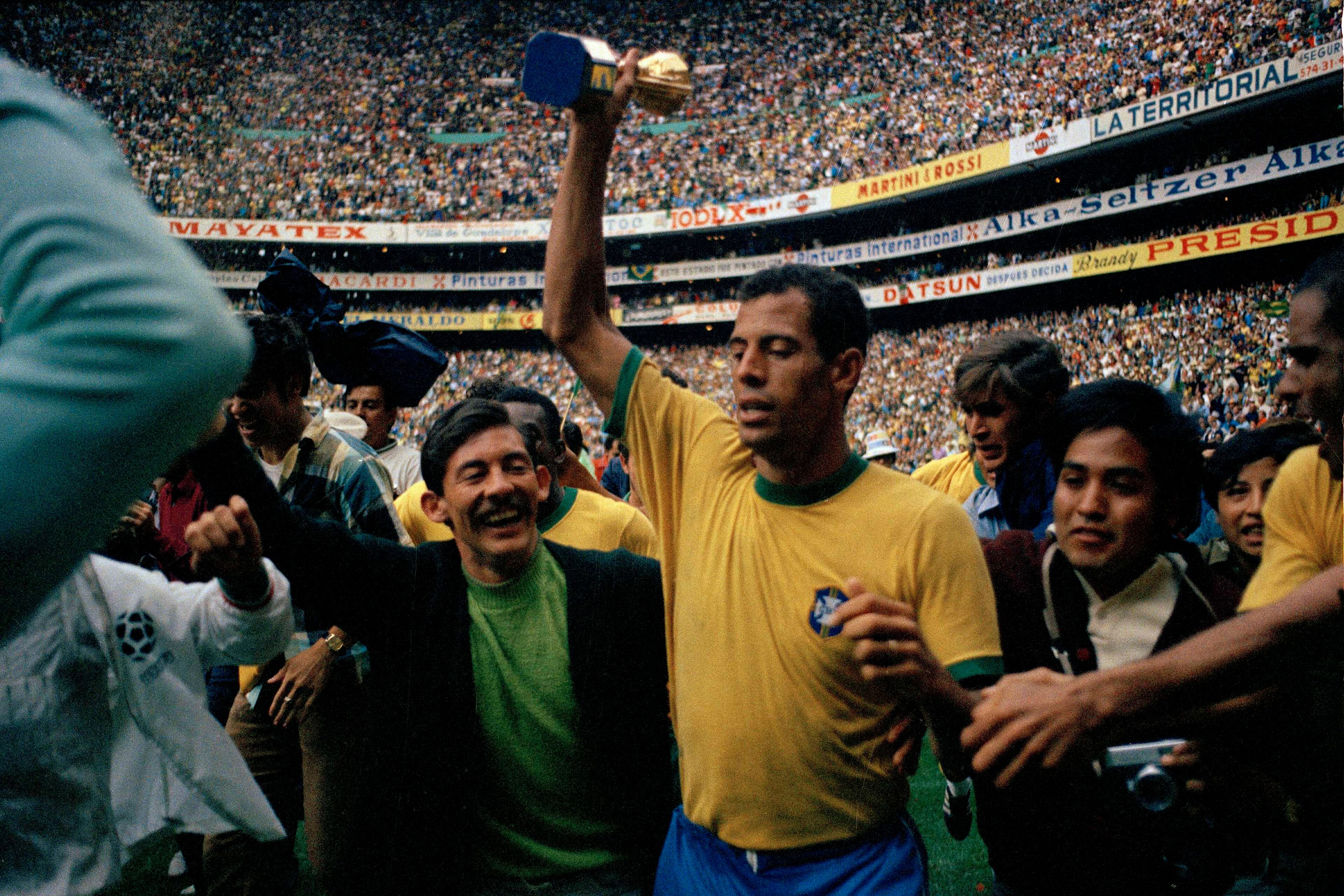 Carlos Alberto celebrates with the World Cup after the 1970 final Carlos Alberto celebrates with the World Cup after the 1970 final