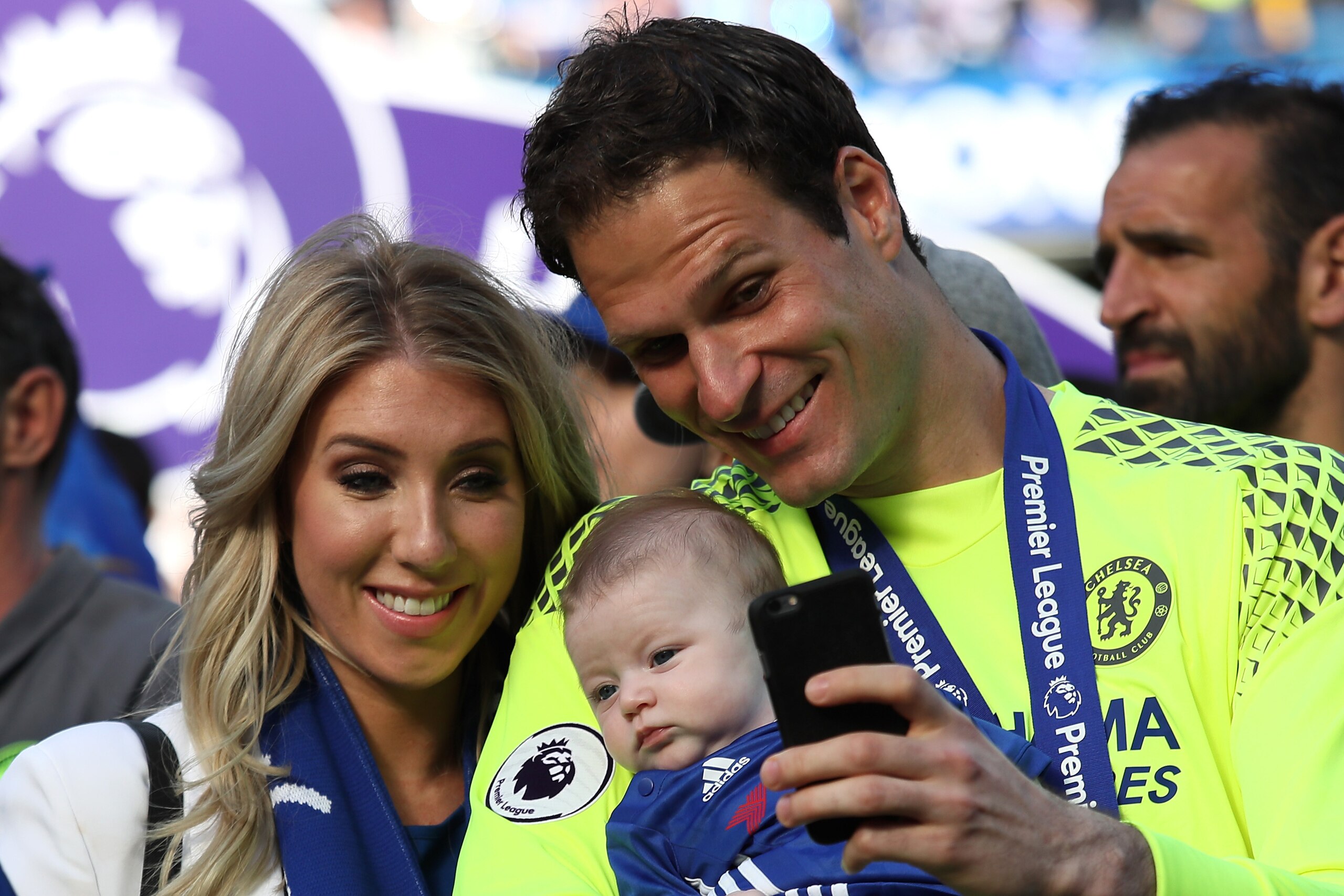 LONDON, ENGLAND - MAY 21:  Asmir Begovic of Chelsea and his wife Nicolle celebrate with their daughter at the end of the Premier League match between Chelsea and Sunderland at Stamford Bridge on May 21, 2017 in London, England.  (Photo by Matthew Ashton -