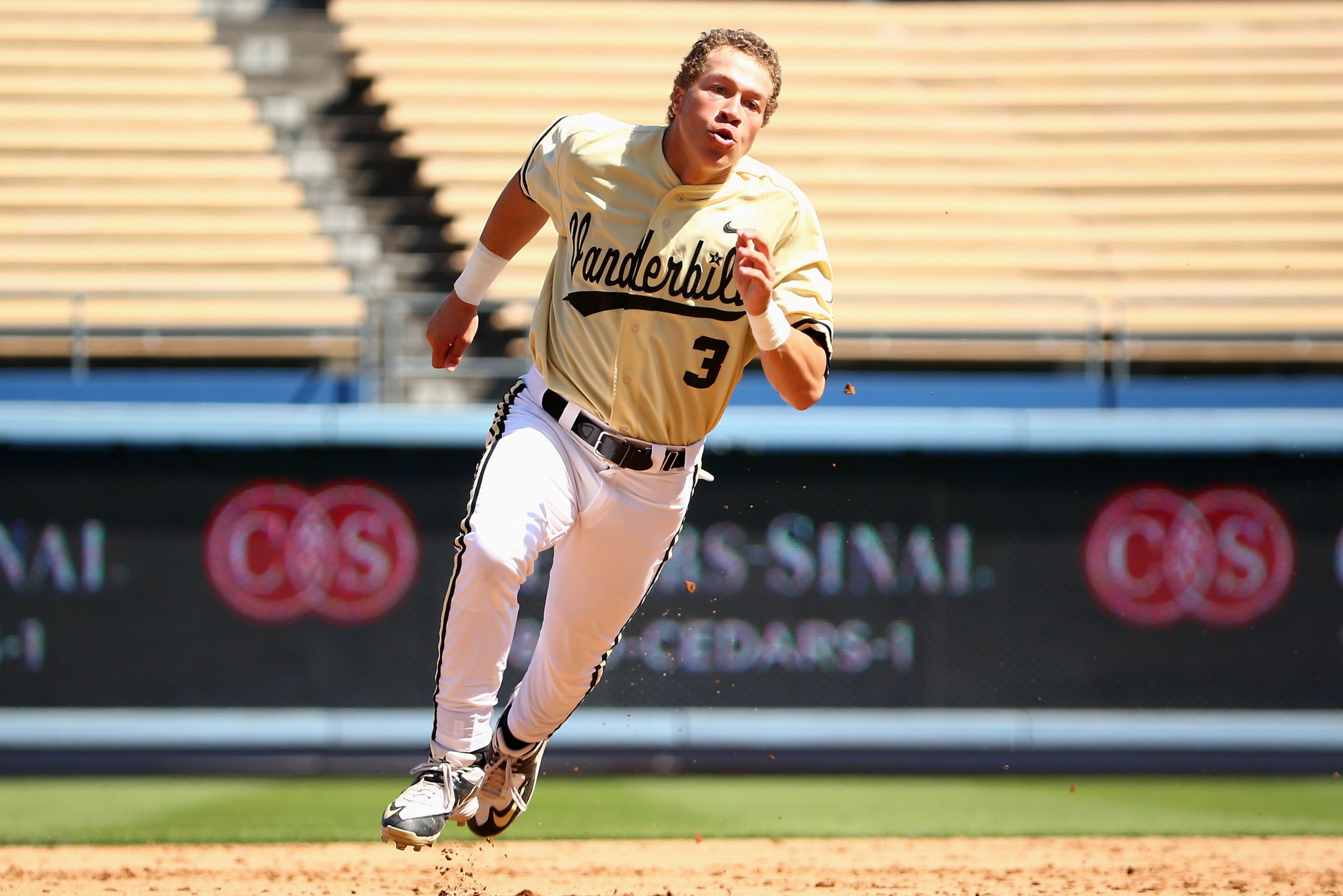 LOS ANGELES, CA - MARCH 08:  Jeren Kendall #3 of Vanderbilt rounds second base on his way to third base on his triple during their Dodger Stadium College Baseball Classic against TCU at Dodger Stadium on March 8, 2015 in Los Angeles, California. TCU defea