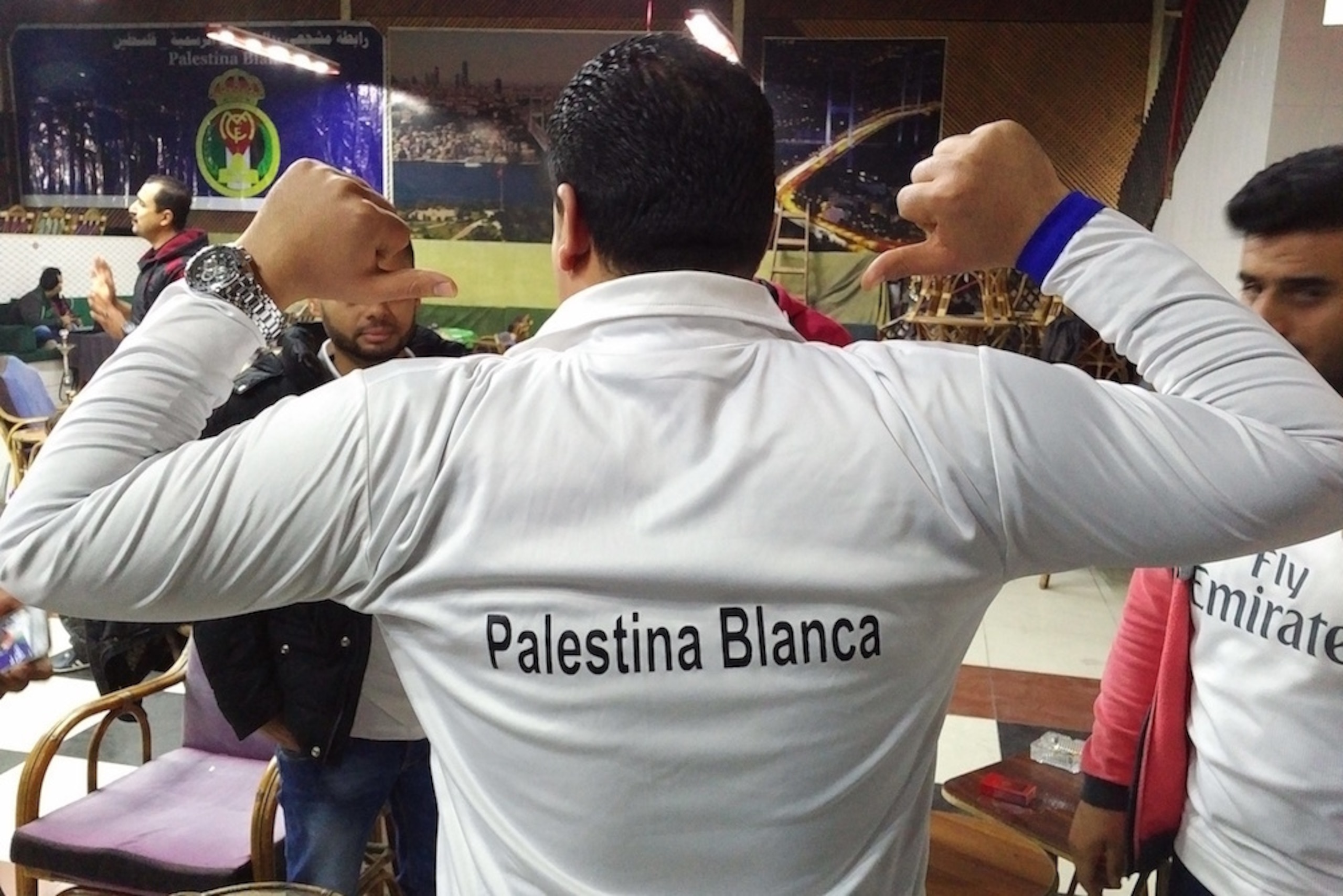 A Palestina Blanca prepares to watch his beloved Real Madrid play.