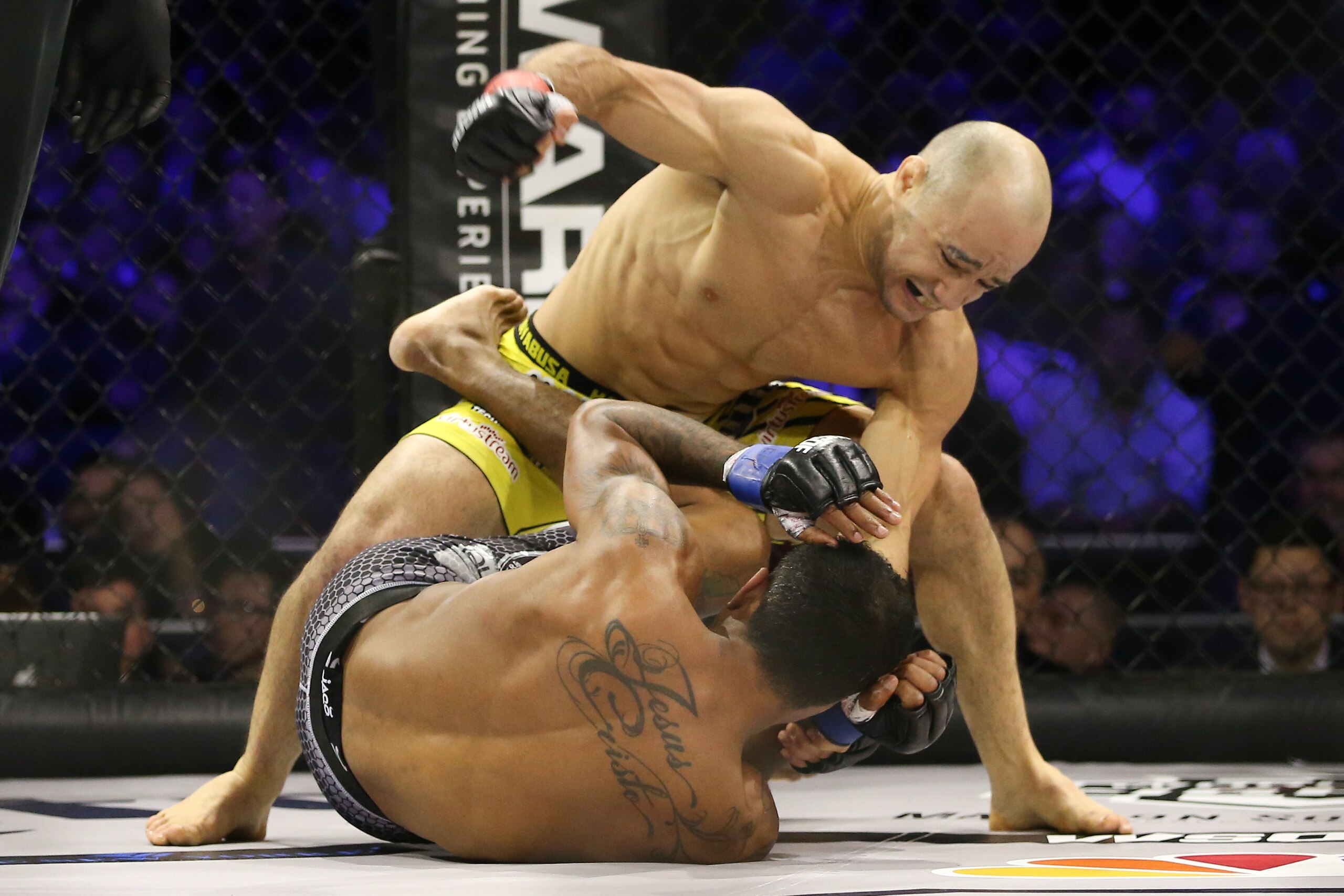 NEW YORK, NY - DECEMBER 31: Marlon Moraes (top) throws a right hand at Josenaldo Silva (bottom) during their World Series of Fighting bantamweight championship fight at The Theater at Madison Square Garden on December 31, 2016 in New York City. (Photo by 