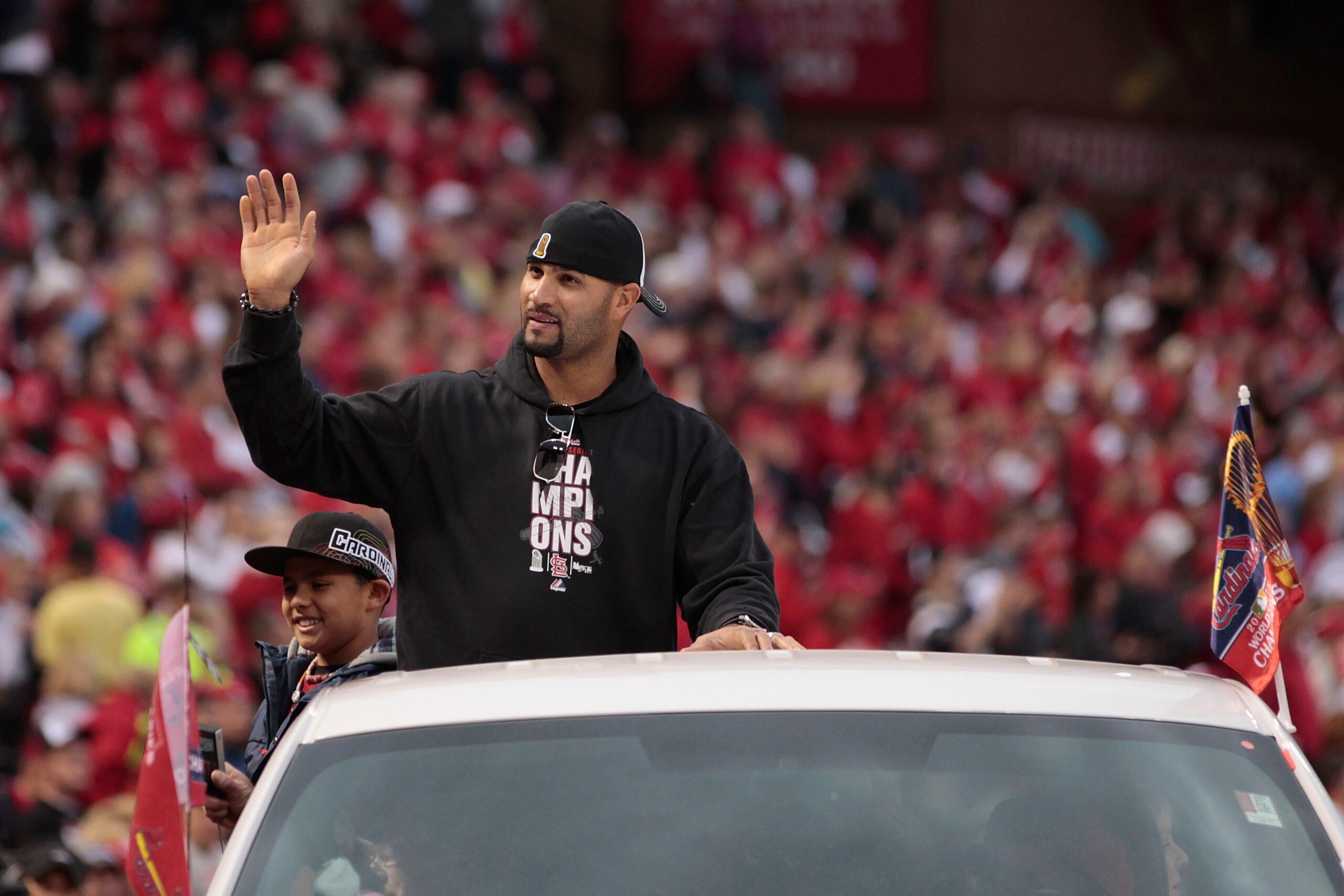 ST. LOUIS, MO - OCTOBER 30:  Albert Pujols of the St. Louis Cardinals participates in a parade celebrating the team's 11th World Series championship October 30, 2011 at Busch Stadium in St. Louis, Missouri. (Photo by Whitney Curtis/Getty Images)