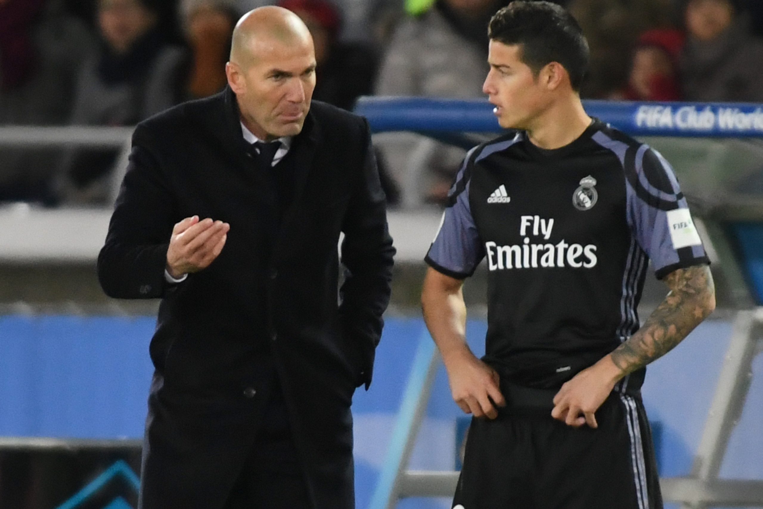 YOKOHAMA, JAPAN - DECEMBER 15: Zinedine Zidane,coach (L) and James Rodriguez of Real Madrid look on during the FIFA Club World Cup Semi Final between Club America and Real Madrid at International Stadium Yokohama on December 15, 2016 in Yokohama, Japan. YOKOHAMA, JAPAN - DECEMBER 15: Zinedine Zidane,coach (L) and James Rodriguez of Real Madrid look on during the FIFA Club World Cup Semi Final between Club America and Real Madrid at International Stadium Yokohama on December 15, 2016 in Yokohama, Japan.