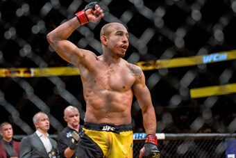 Jul 9, 2016; Las Vegas, NV, USA; Jose Aldo (red gloves) reacts to his win over Frankie Edgar (blue gloves) during UFC 200 at T-Mobile Arena. Mandatory Credit: Joshua Dahl-USA TODAY Sports