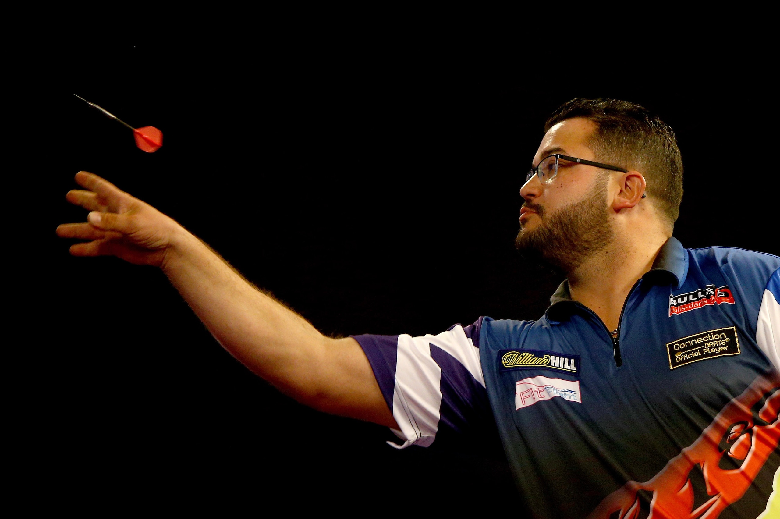 LONDON, ENGLAND - DECEMBER 22:  Cristo Reyes of Spain of Spain in action during his match against Wes Newton of England during the 2016 William Hill PDC World Darts Championships on Day Five at Alexandra Palace on December 22, 2015 in London, England.  (P